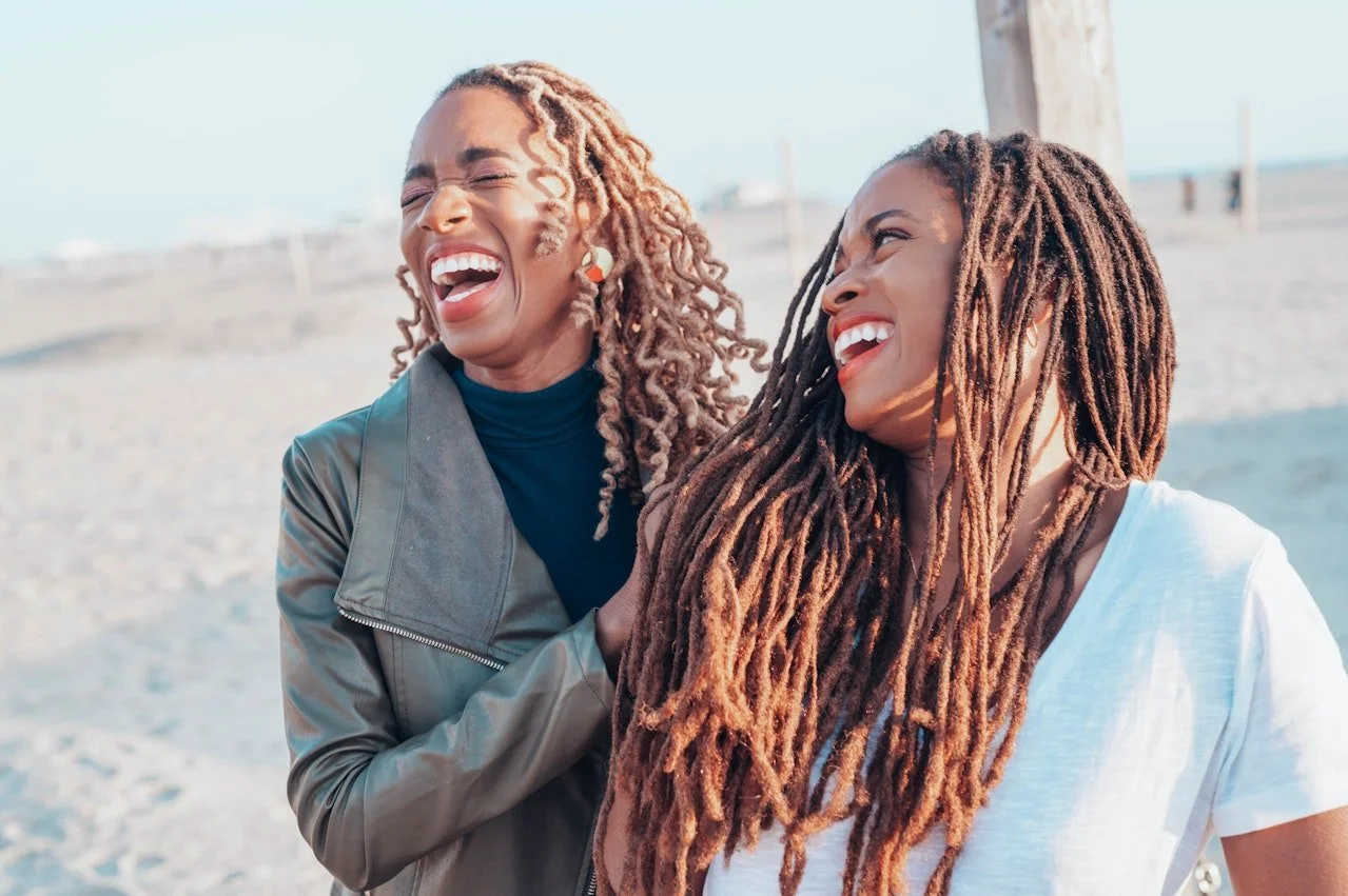 Two sisters laughing together