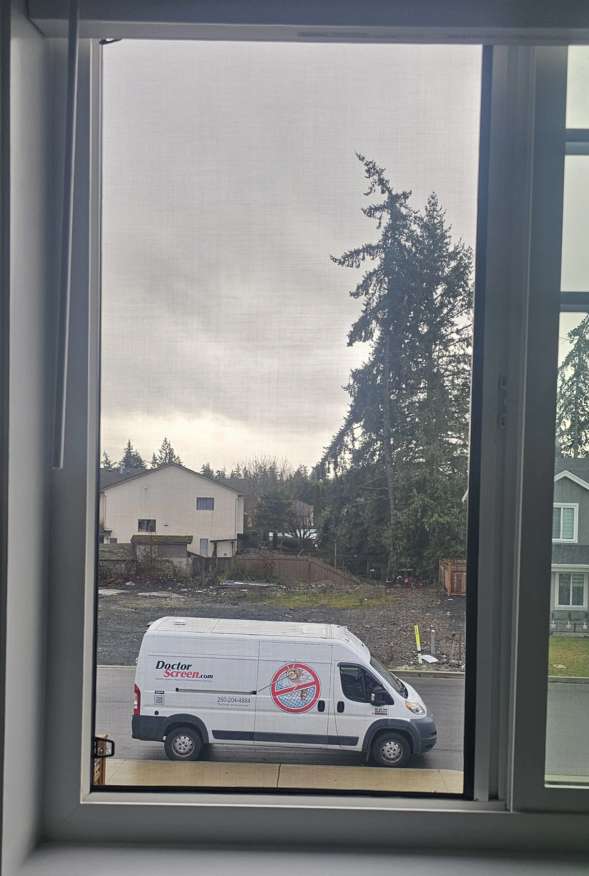 Doctor Screen van on location through a customized window screen