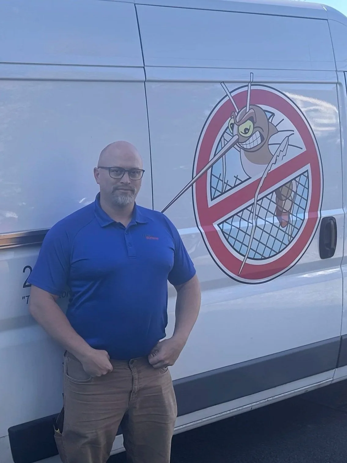 Don Shand standing beside his mobile screen workshop.