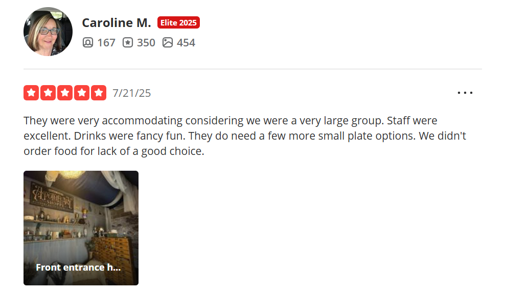 5 star Yelp Review for Whisperz Speakeasy with a picture of the secret entryway.