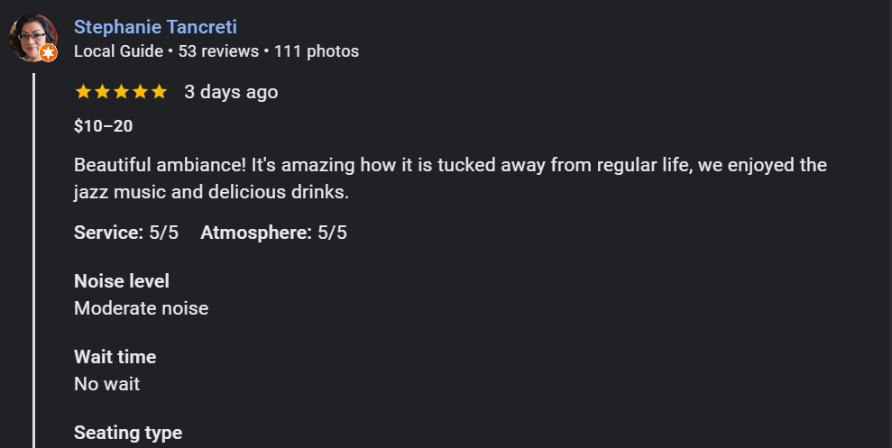 A Google review for a Whisperz Speakeasy mentioning its ambiance, music, drinks, service, atmosphere, noise level, wait time, and seating type.