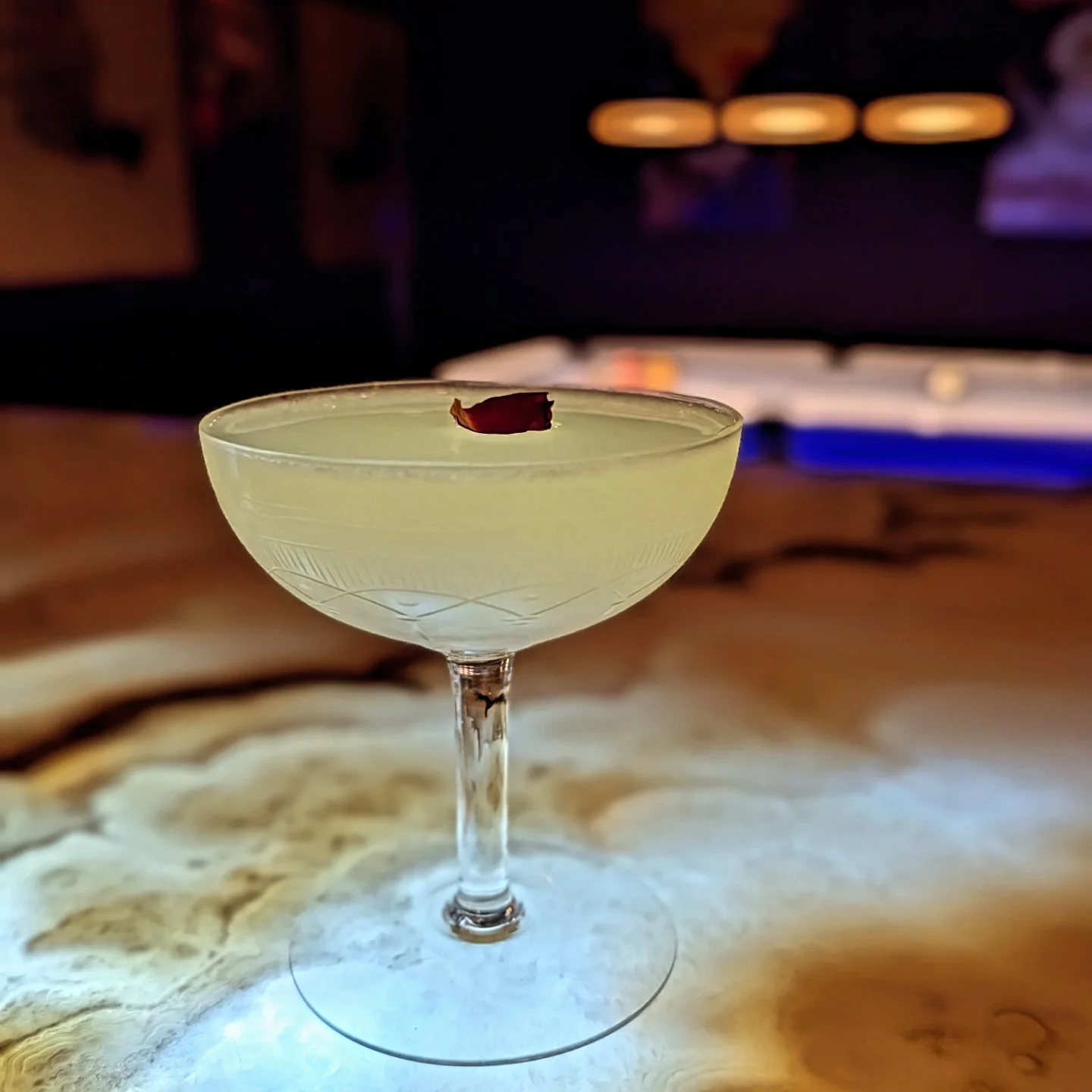 A delicious hand-crafted cocktail, garnished beautifully at Whisperz Speakeasy.