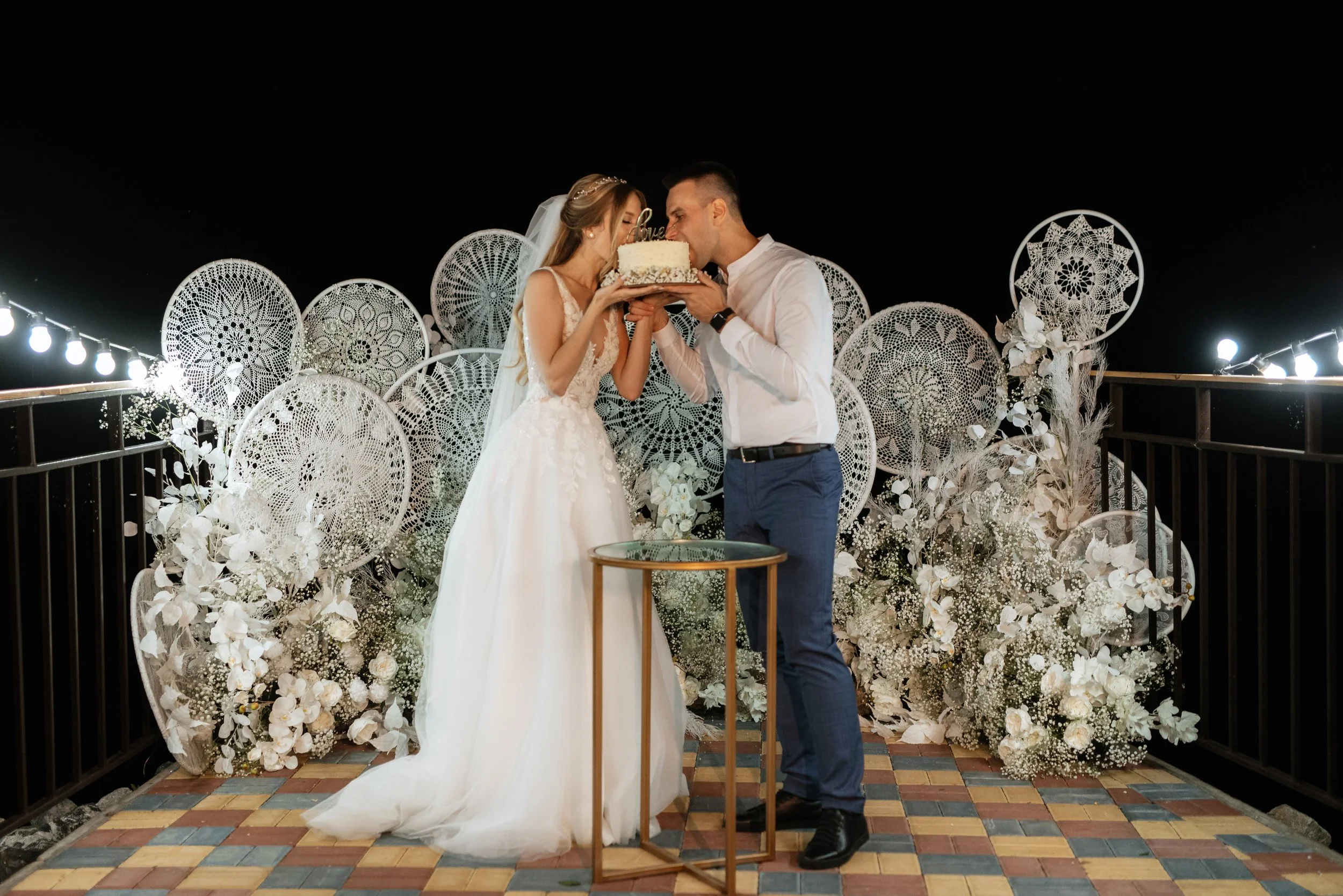 newlyweds-happily-cut-and-taste-the-wedding-cake-2023-11-27-04-57-55-utc.jpg