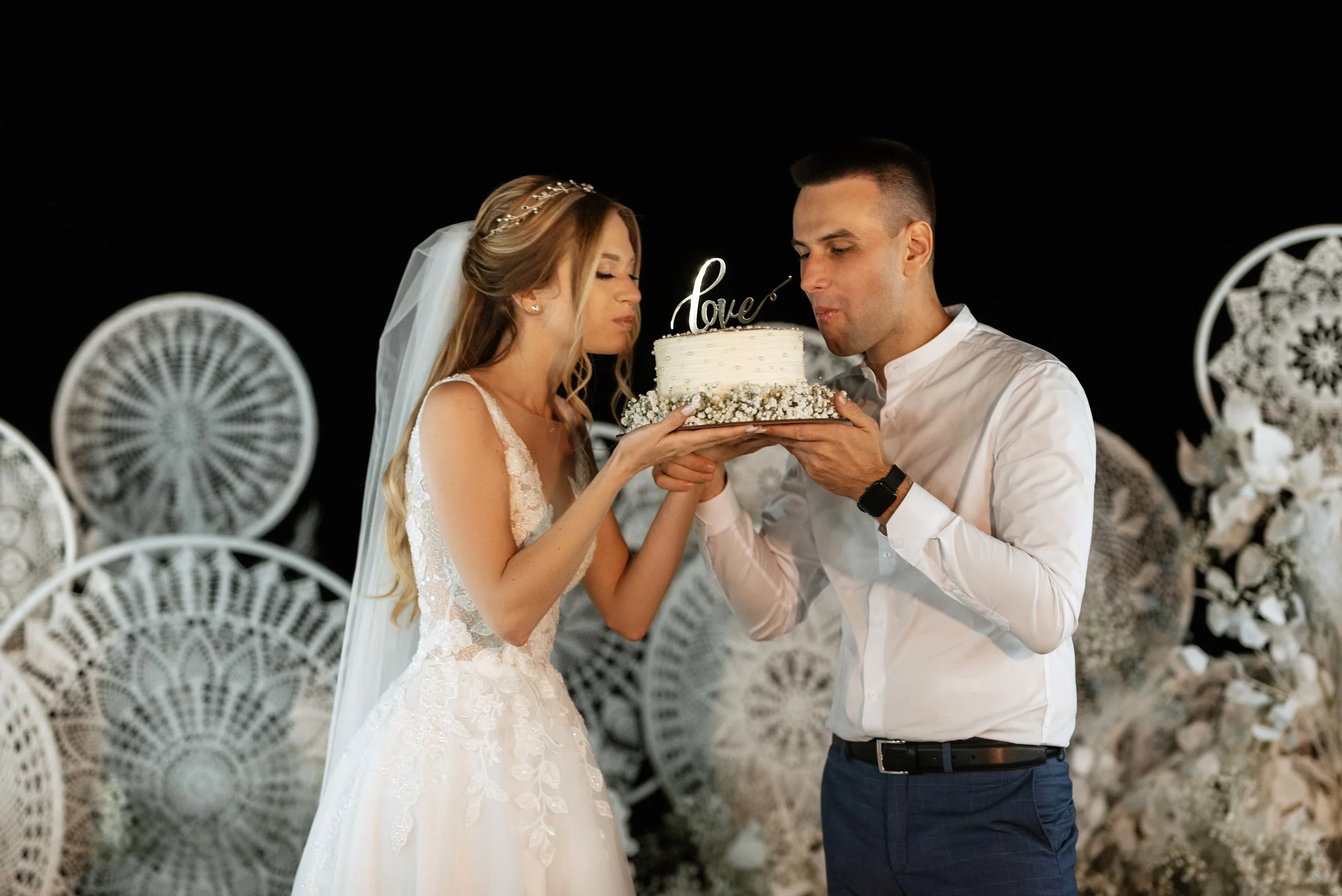 newlyweds-happily-cut-and-taste-the-wedding-cake-2023-11-27-05-30-23-utc.jpg