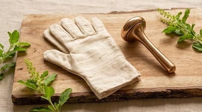 Kansa wand and dry brushing gloves used to stimulate stagnant Kapha lymph