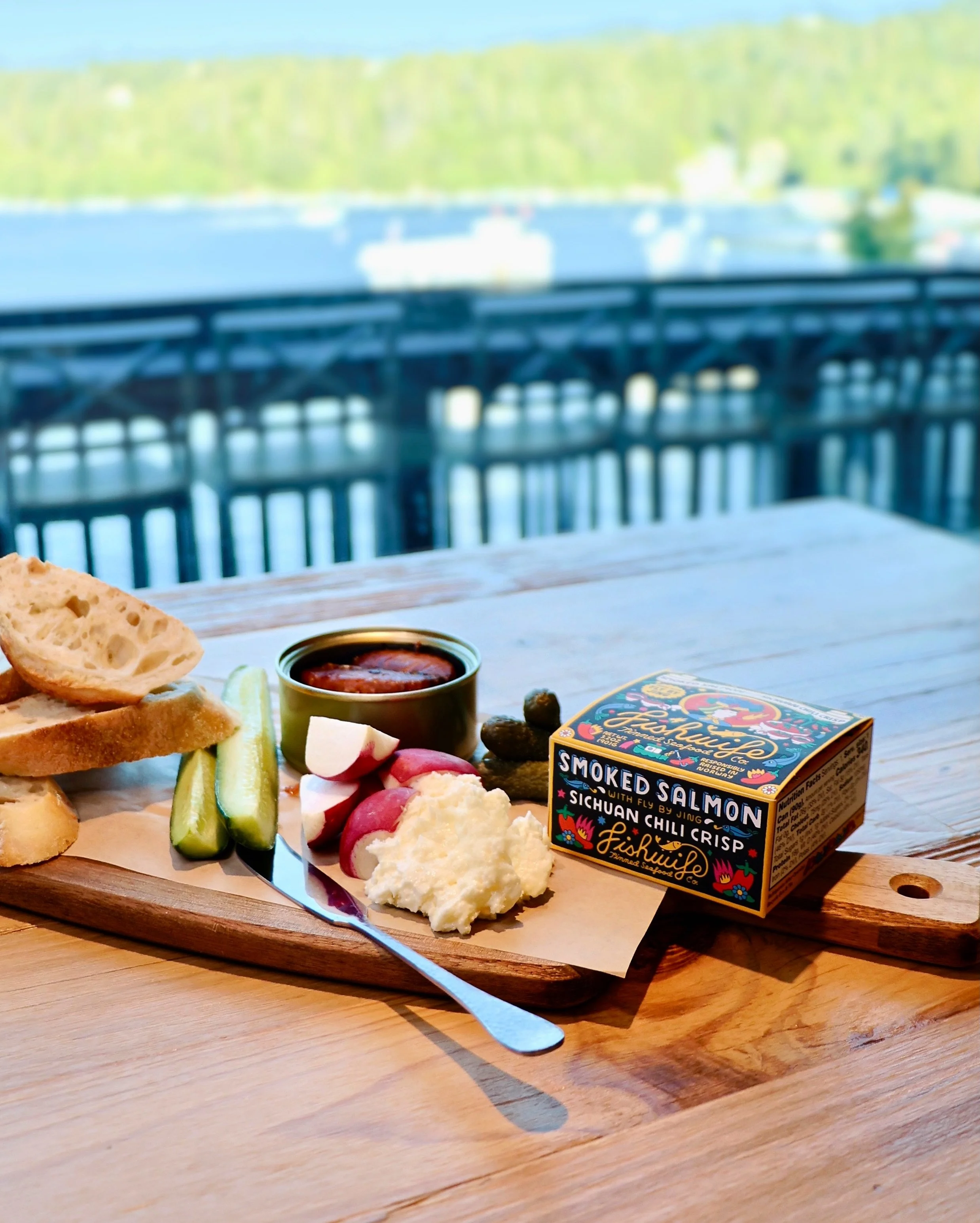 🐟 Our Tinned Fish Platter is the ultimate table-pleaser!

👉🏼 Choose between premium sardines or a curated catch&mdash;like this smoky, savory salmon from @eatfishwife. We pair it with crisp cucumber, cornichons, radish, butter, and fresh bread.

?