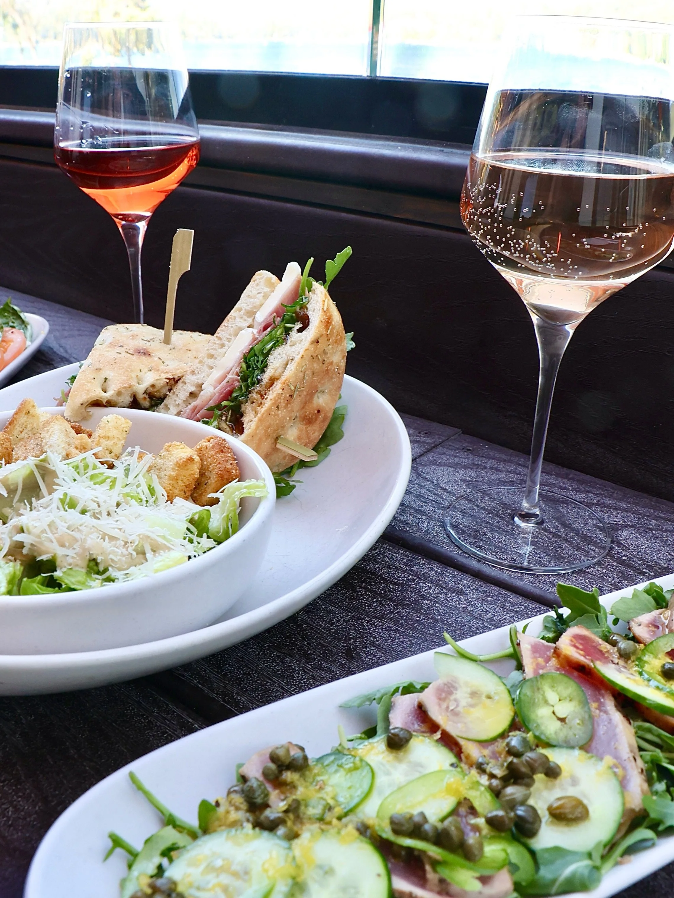 🍷 Sundays are meant for good food, lake views, crisp wine, and even better company!

Featuring:
🥪 Prosciutto &amp; Brie Sandwich: Savory prosciutto, creamy brie, fig jam, and baby arugula on schiacciata bread. Served with a side of your choice&mdas