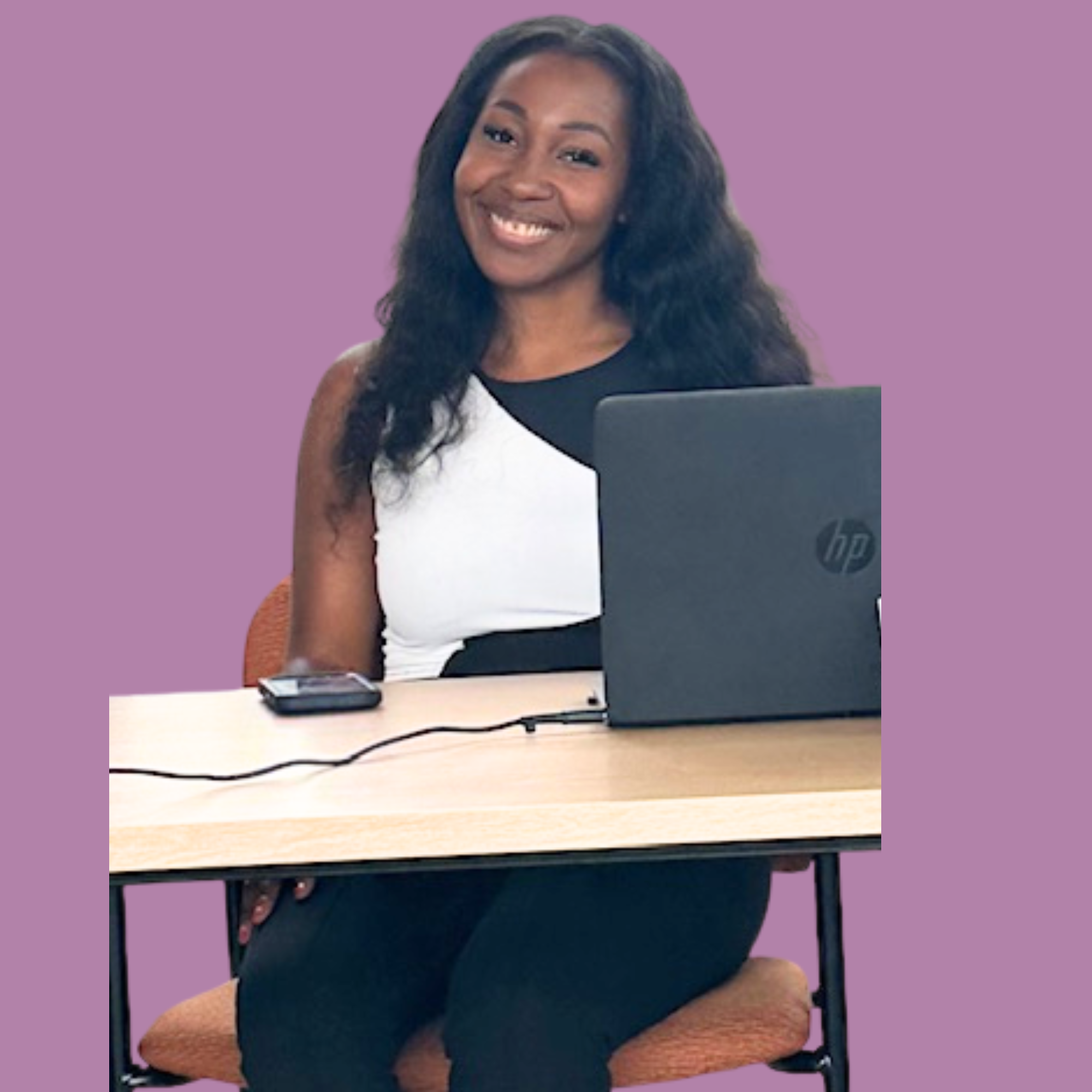 A woman with long curly hair smiling at the camera, sitting at a desk with a black HP laptop and a smartphone on the table, against a purple background.