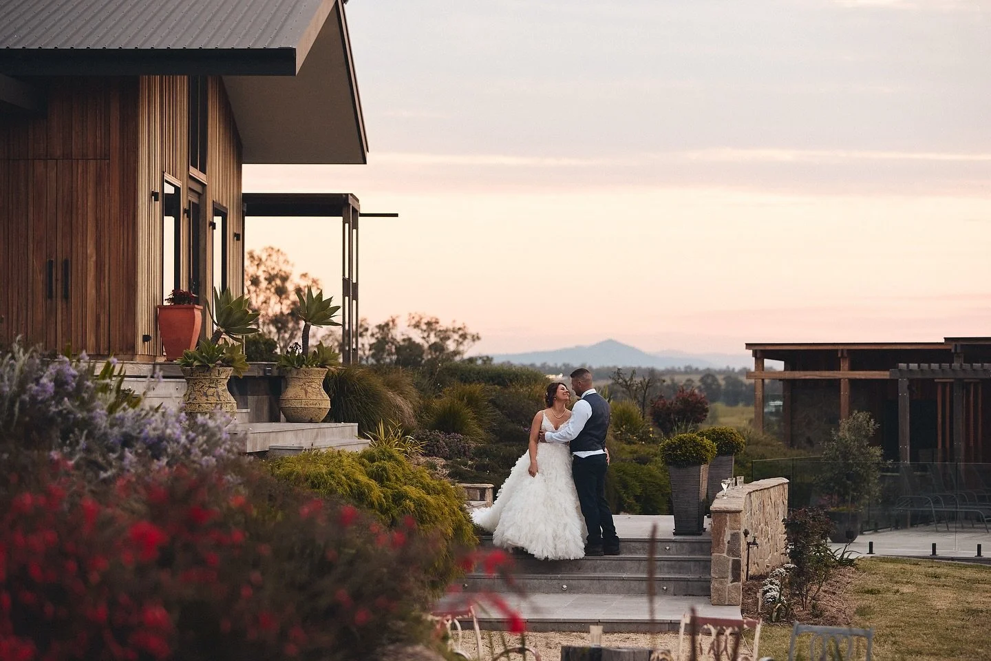 There&rsquo;s so much about this photo I love! The sweet look between Aleesha &amp; Mathew, Aleesha&rsquo;s STUNNING bridal gown by @luvbridal, the incredible view &amp; the dreamy pink sky 🩷

I&rsquo;ll share more photos in the coming days from thi