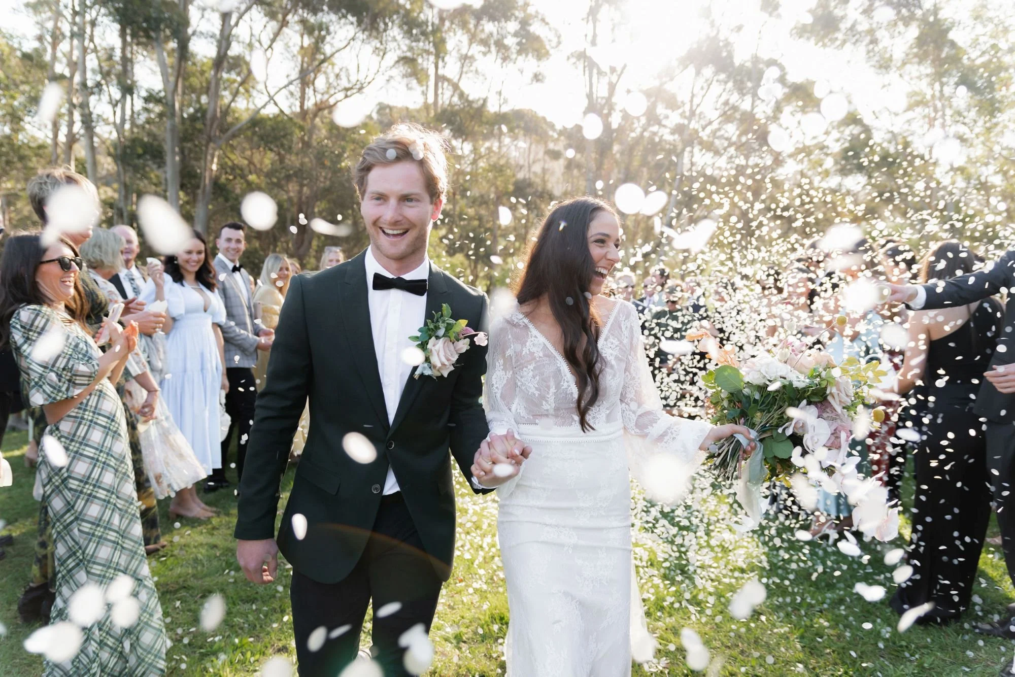 A wedding couple getting showered in confetti at Pepper and Salt Restaurant