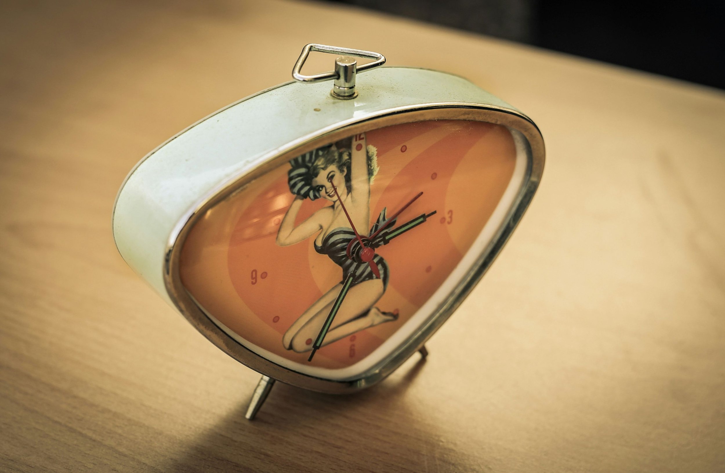 Vintage clock with pin-up girl in the centre