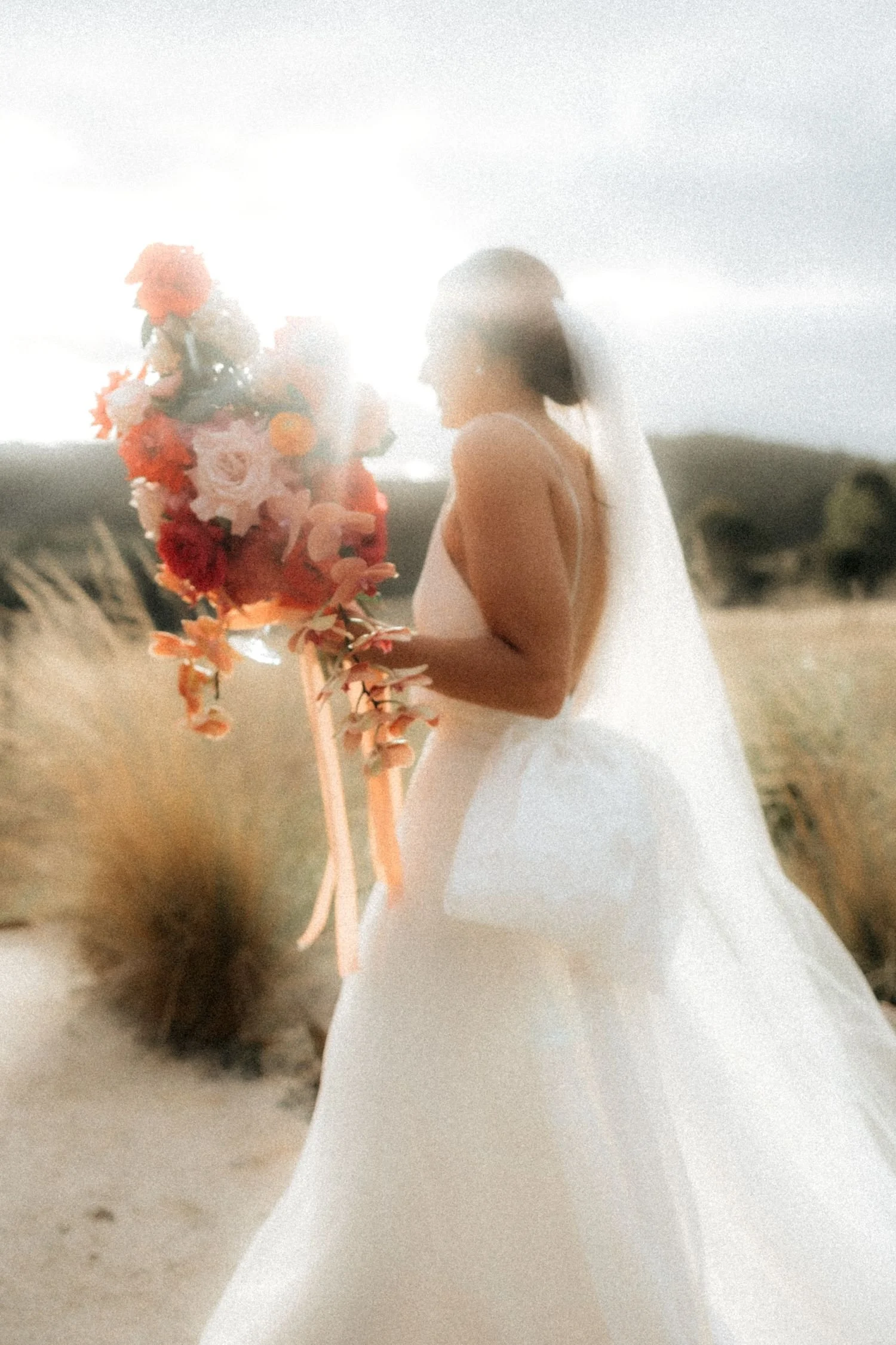 A bride holding a large bridal bouquet in Westen Australia