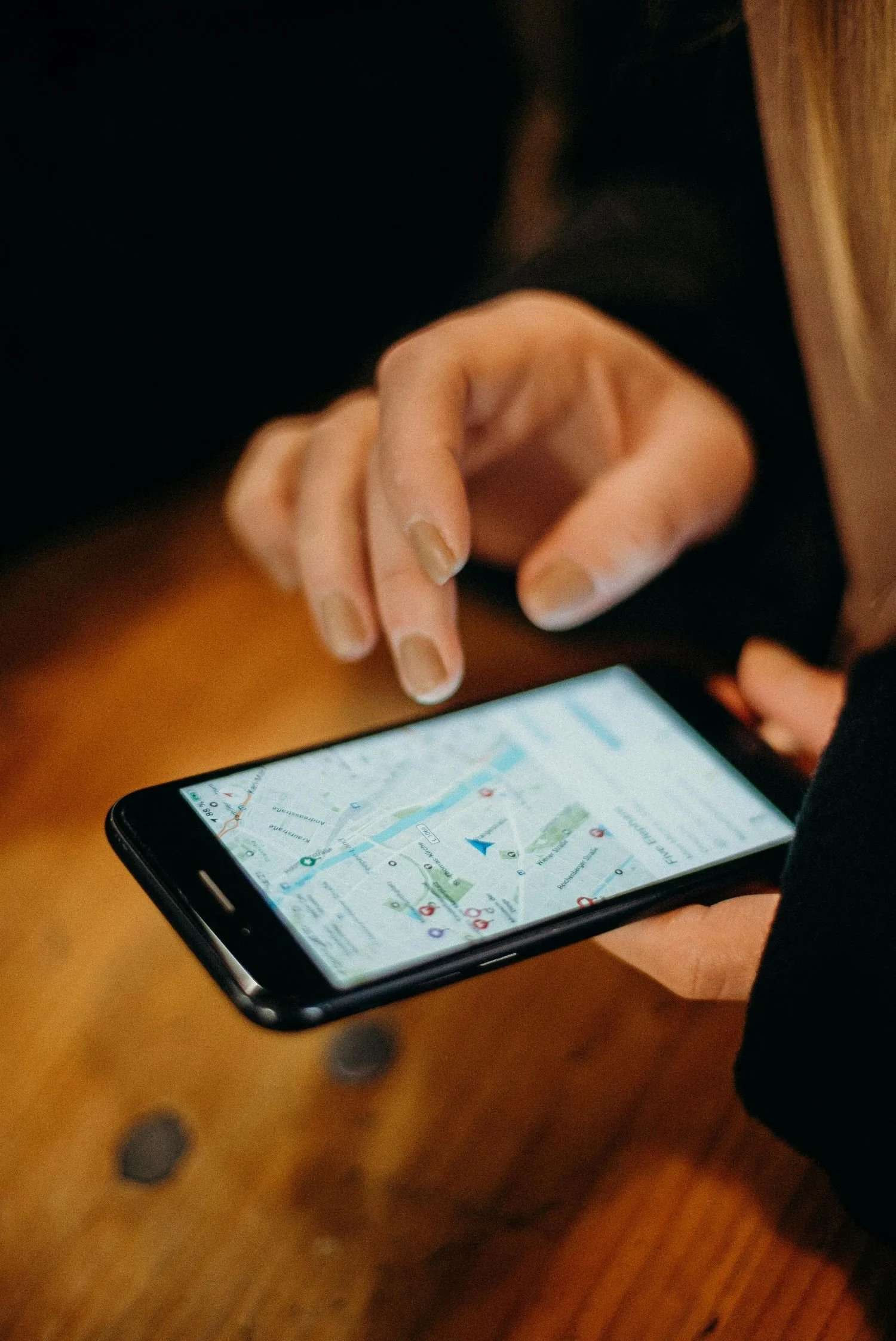 A person using Google seach to find local businesses on their phone