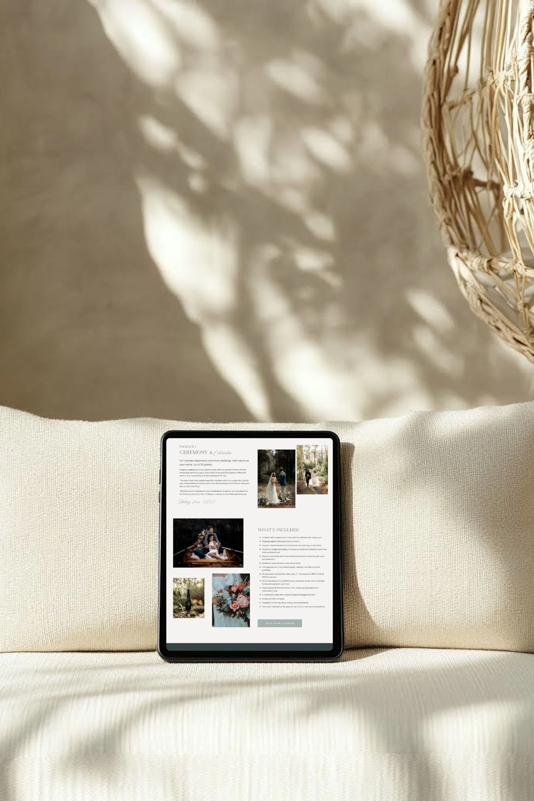 An ipad on a couch displaying Wild Tide Weddings website and her elopement services