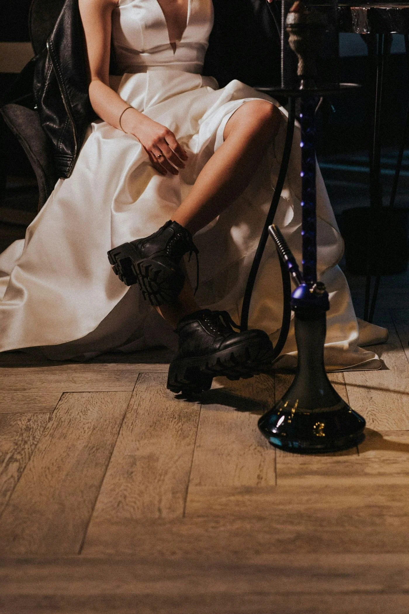 Bride wearing a silk wedding dress and combat boots