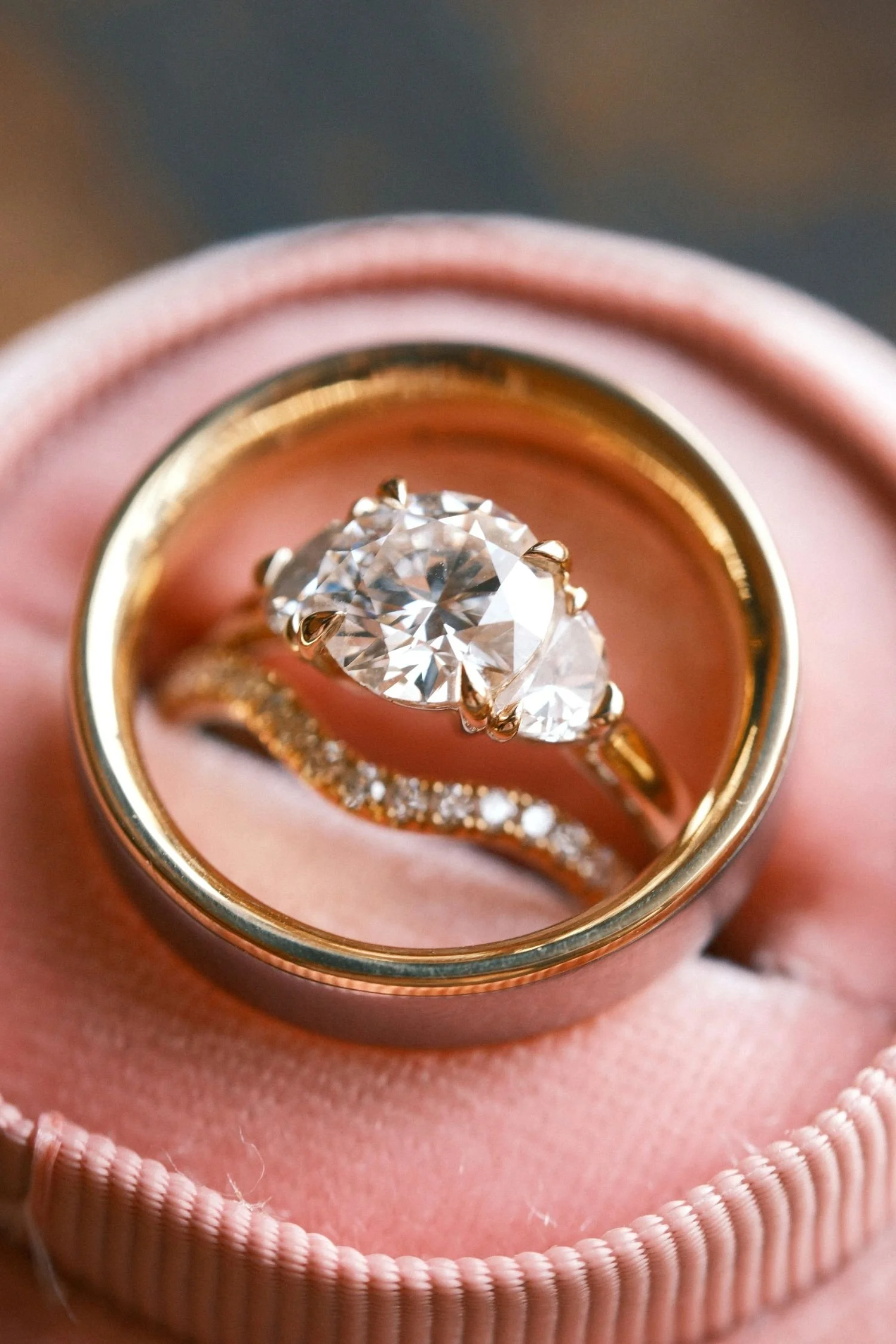A diamond engagement ring and wedding bands