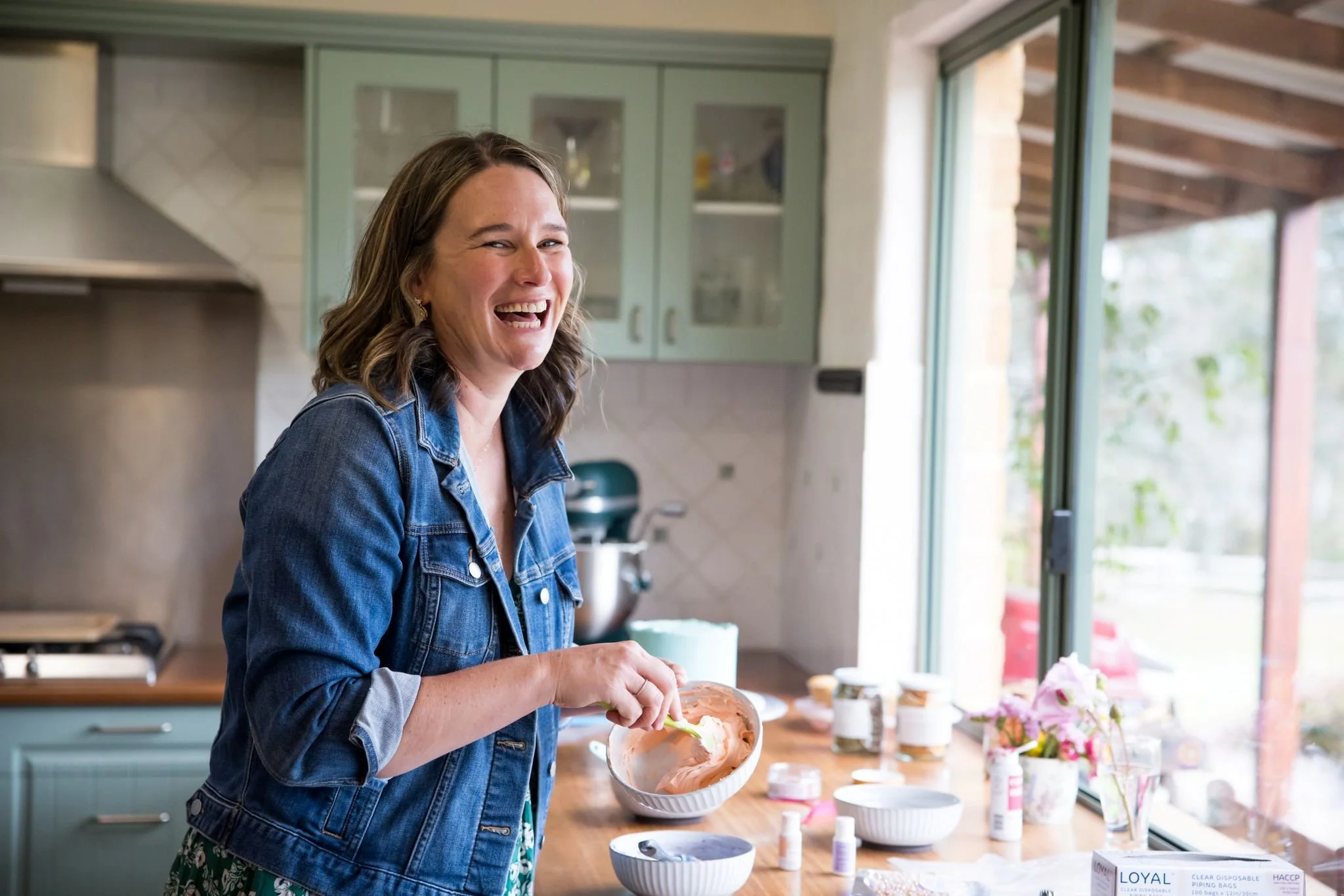 Wedding cake artist Amy Summers making cupcakes in her kitchen