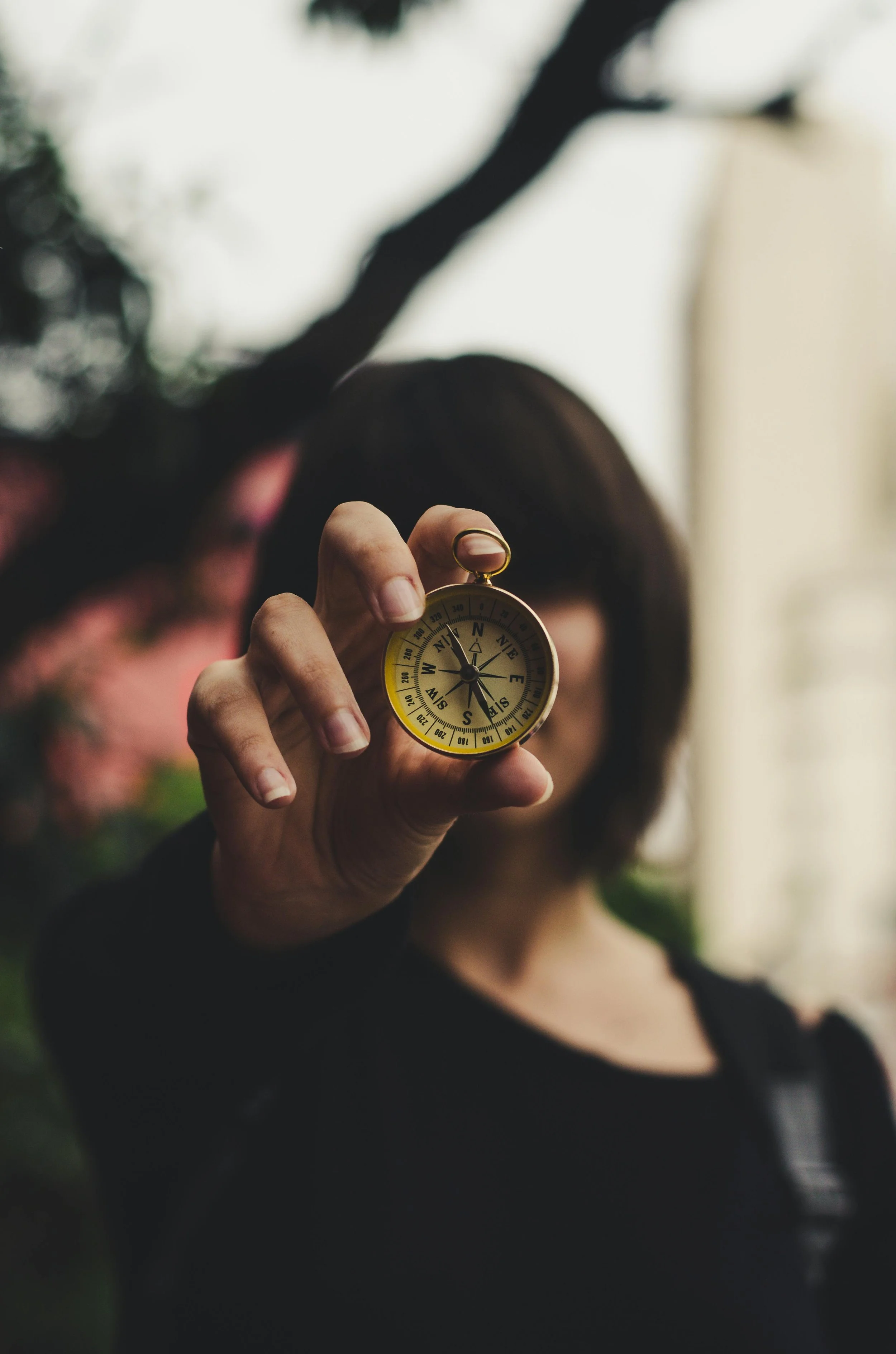 Woman holding a compass