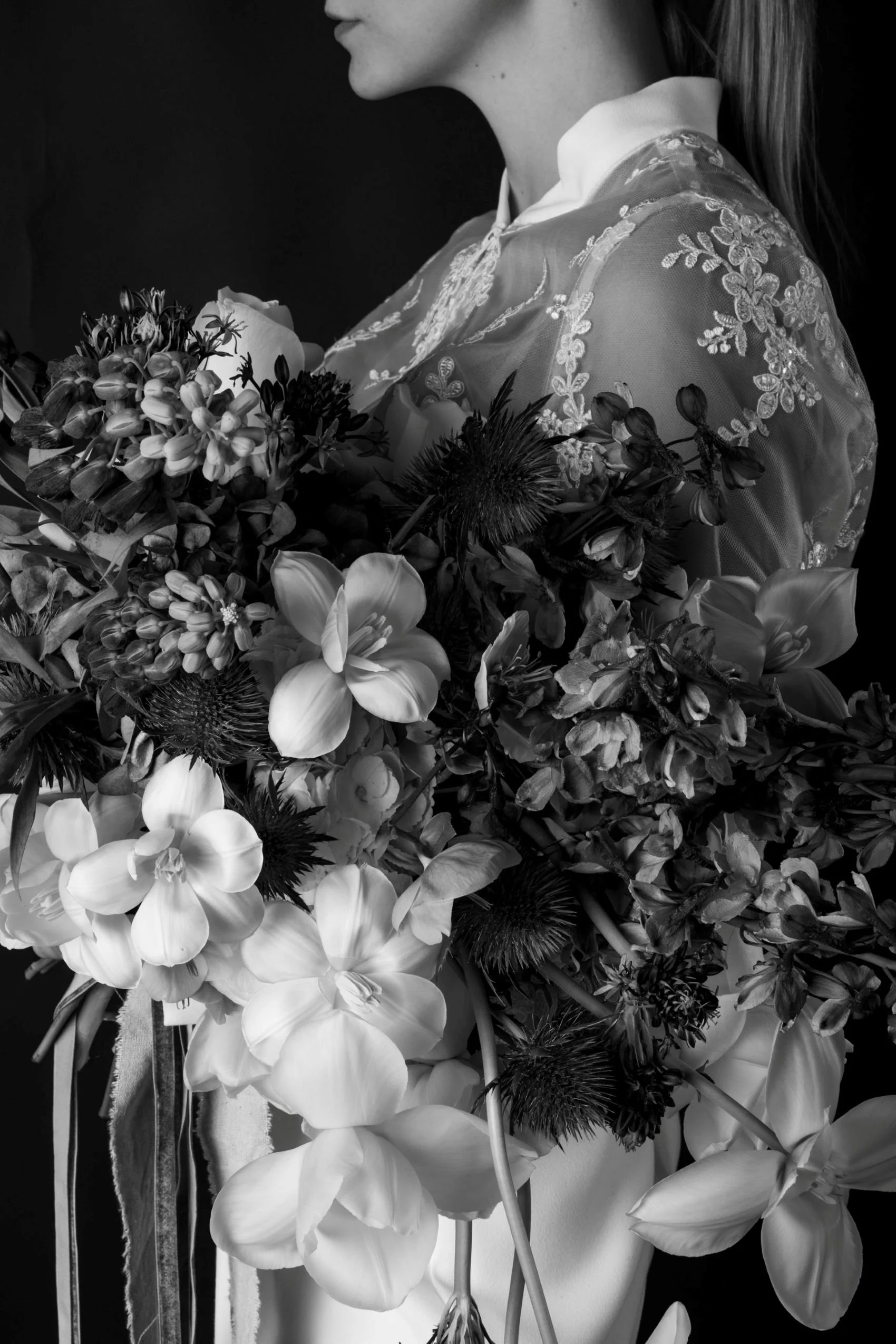 A bride holding a large bridal bouquet