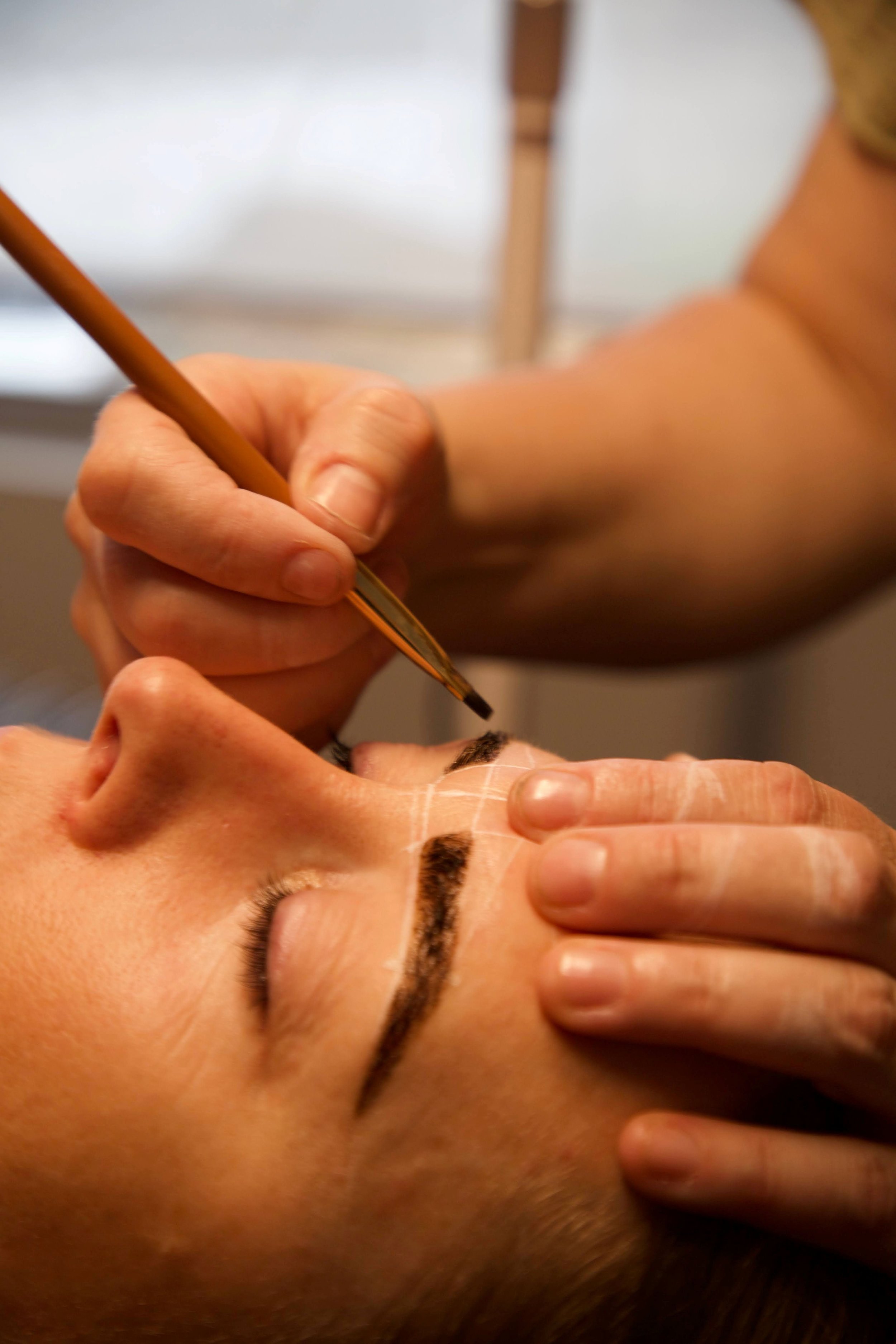 A woman recieving a beauty treatment