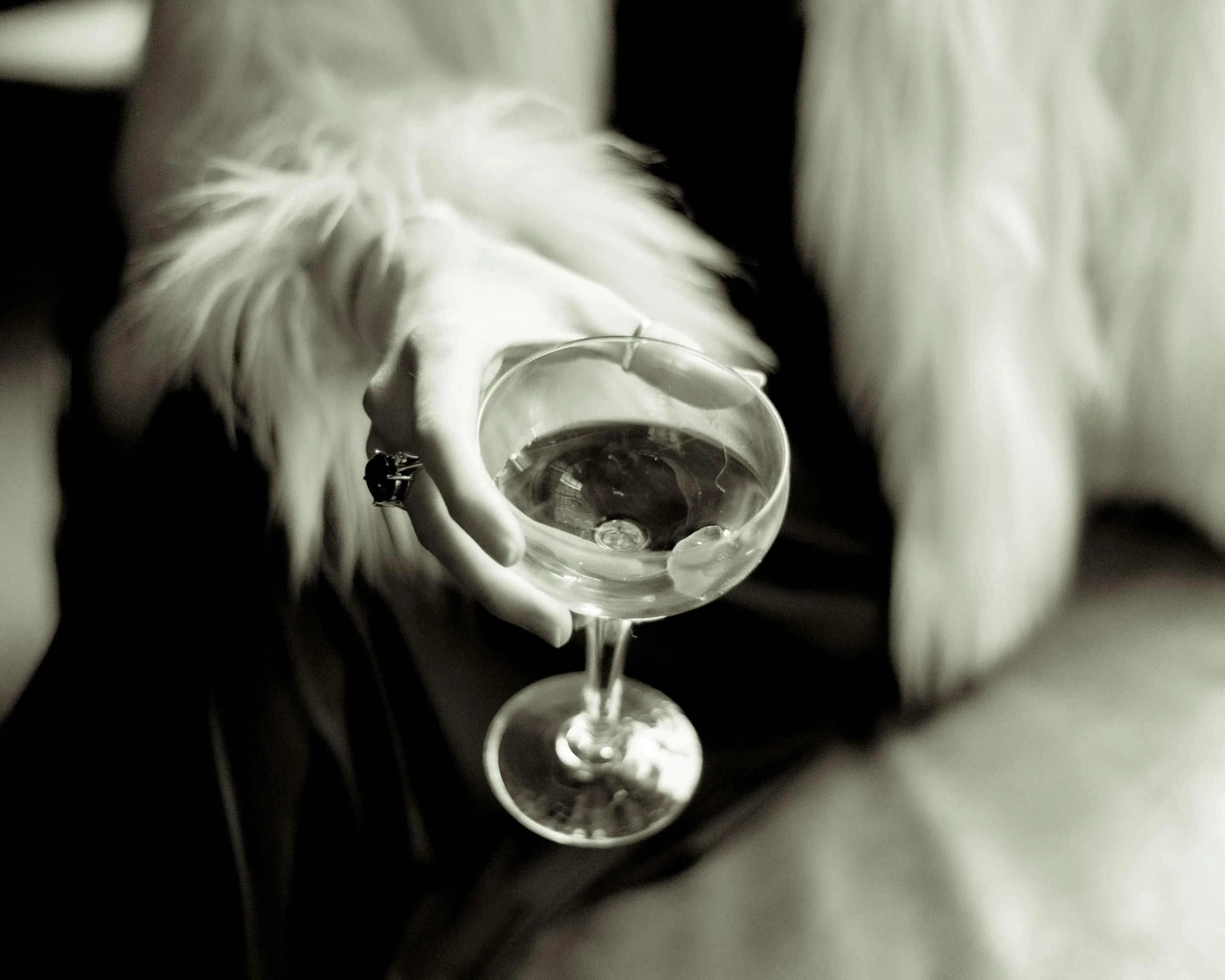 Wedding vendor holding a cocktail