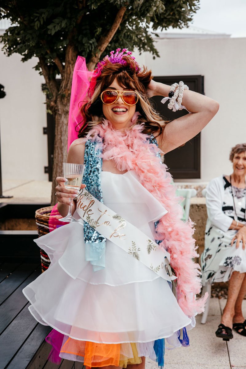 Bride to be in fun, bright, quirky costume at hens party