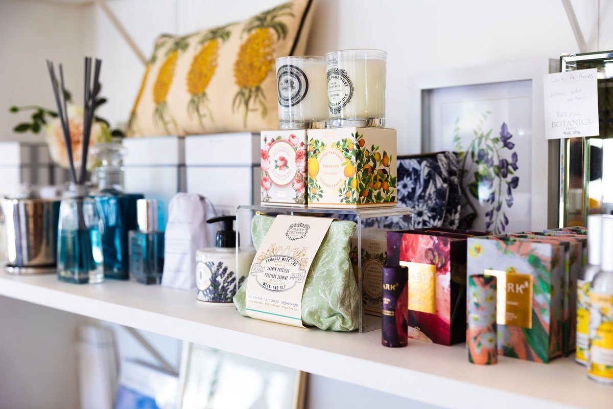 A shelf of brightly coloured homewares and knick knacks in a rural shop