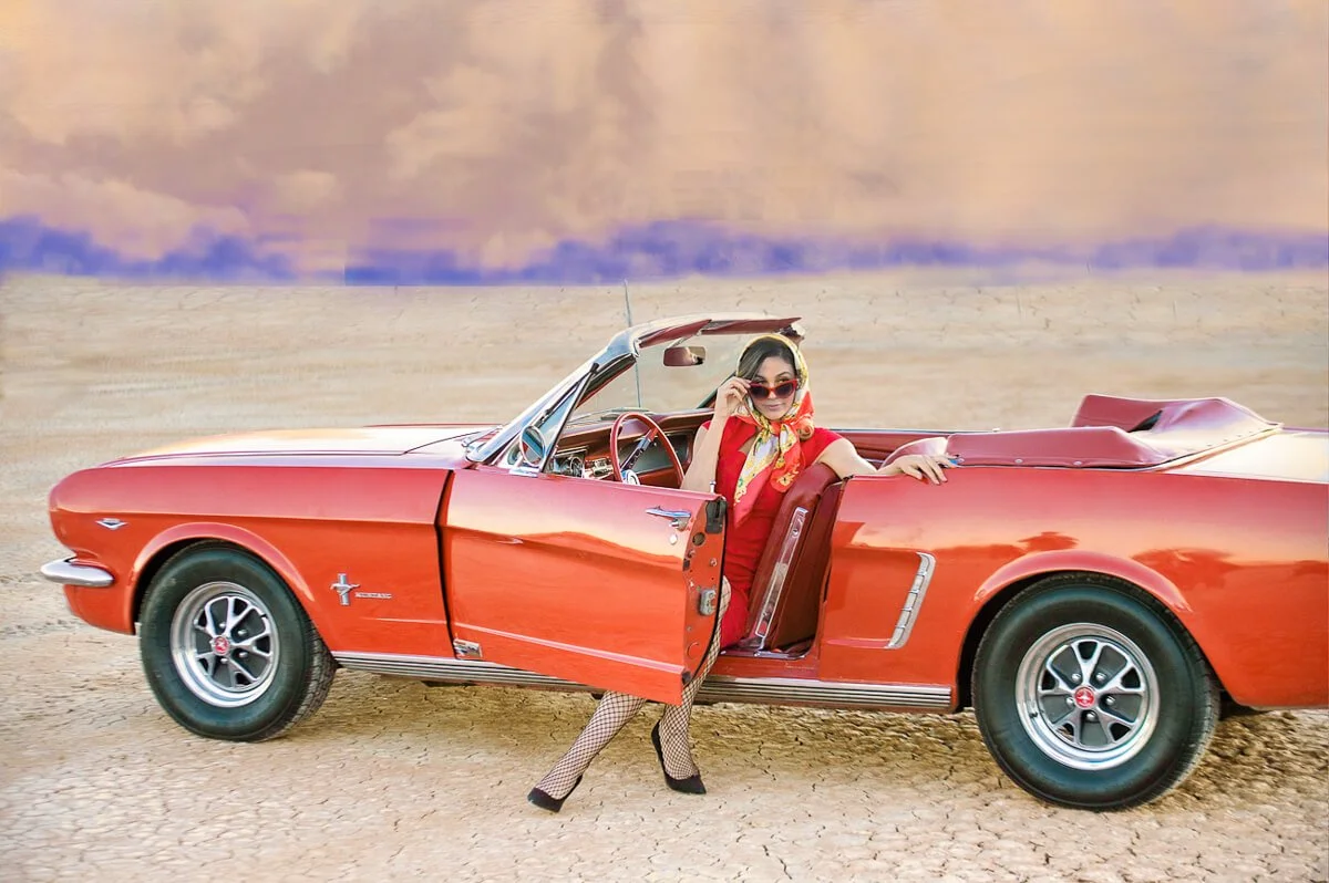 Classic red Mustang, model to match and approaching storm