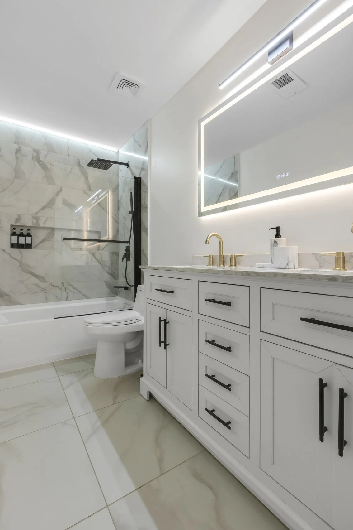 Second bathroom remodel with contemporary tiling and modern fixtures in Roswell home
