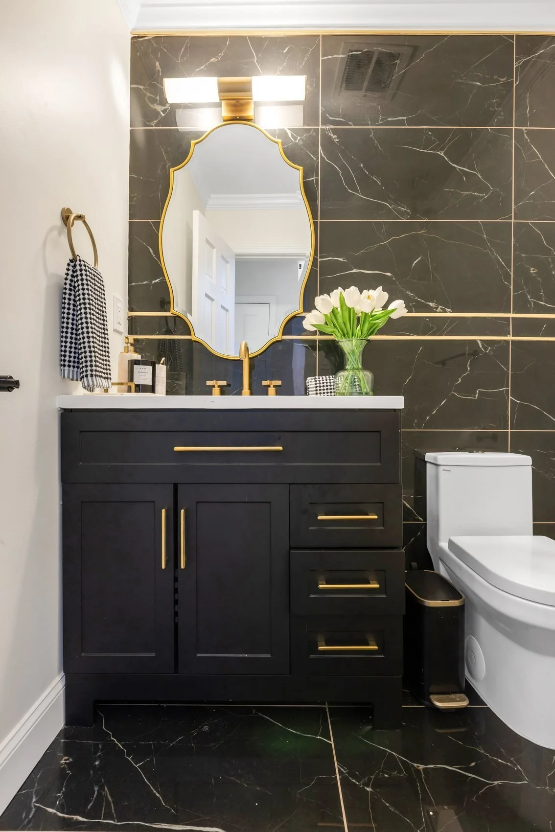 Elegant powder room design with bespoke finishes by Heritage Design Concepts