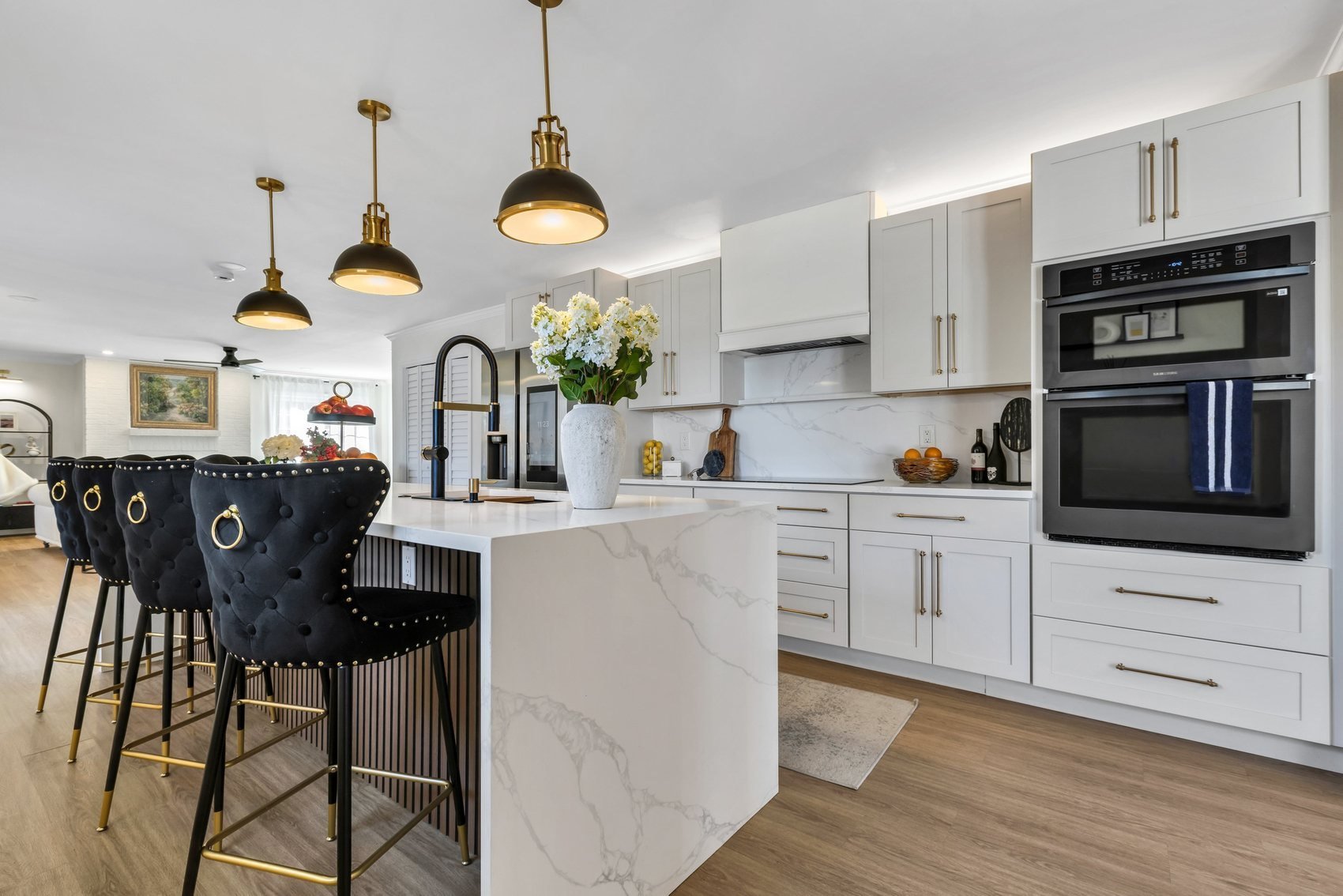 Fully remodelled luxury kitchen with marble island and brass pendant lighting in Roswell Georgia