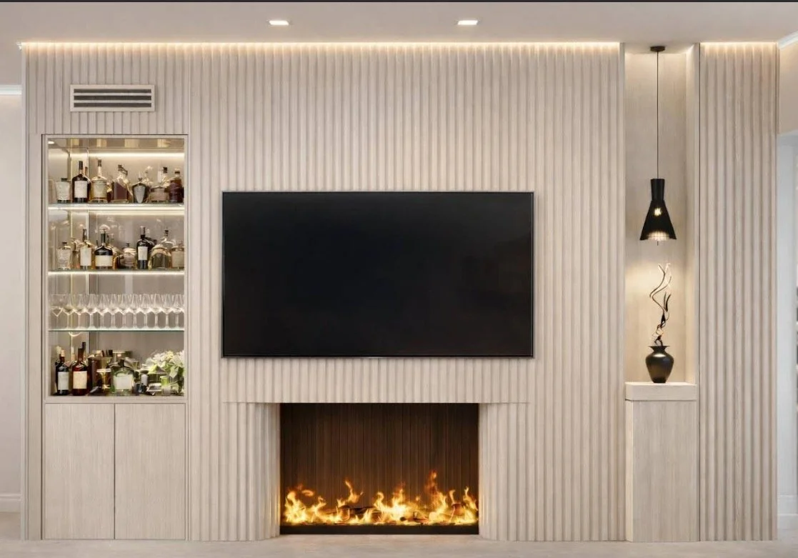 Bespoke ribbed media wall with fireplace and lit bar shelving in Beverly Hills apartment
