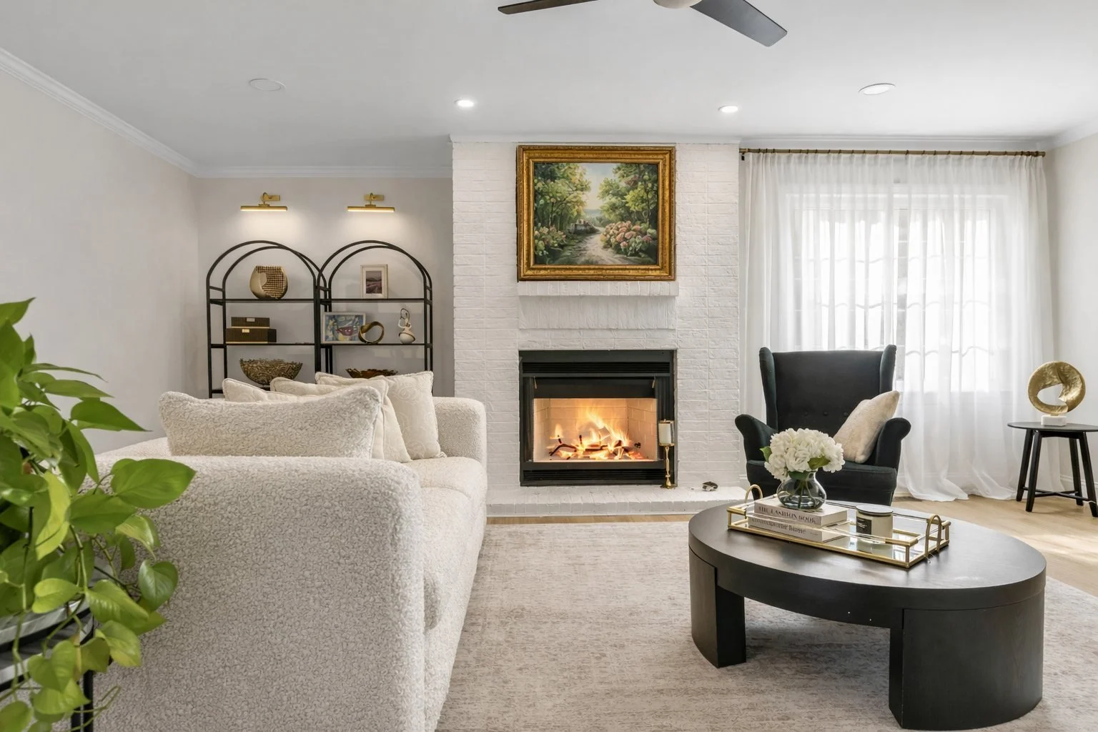 Family room with whitewashed fireplace and curated furnishings, Roswell GA