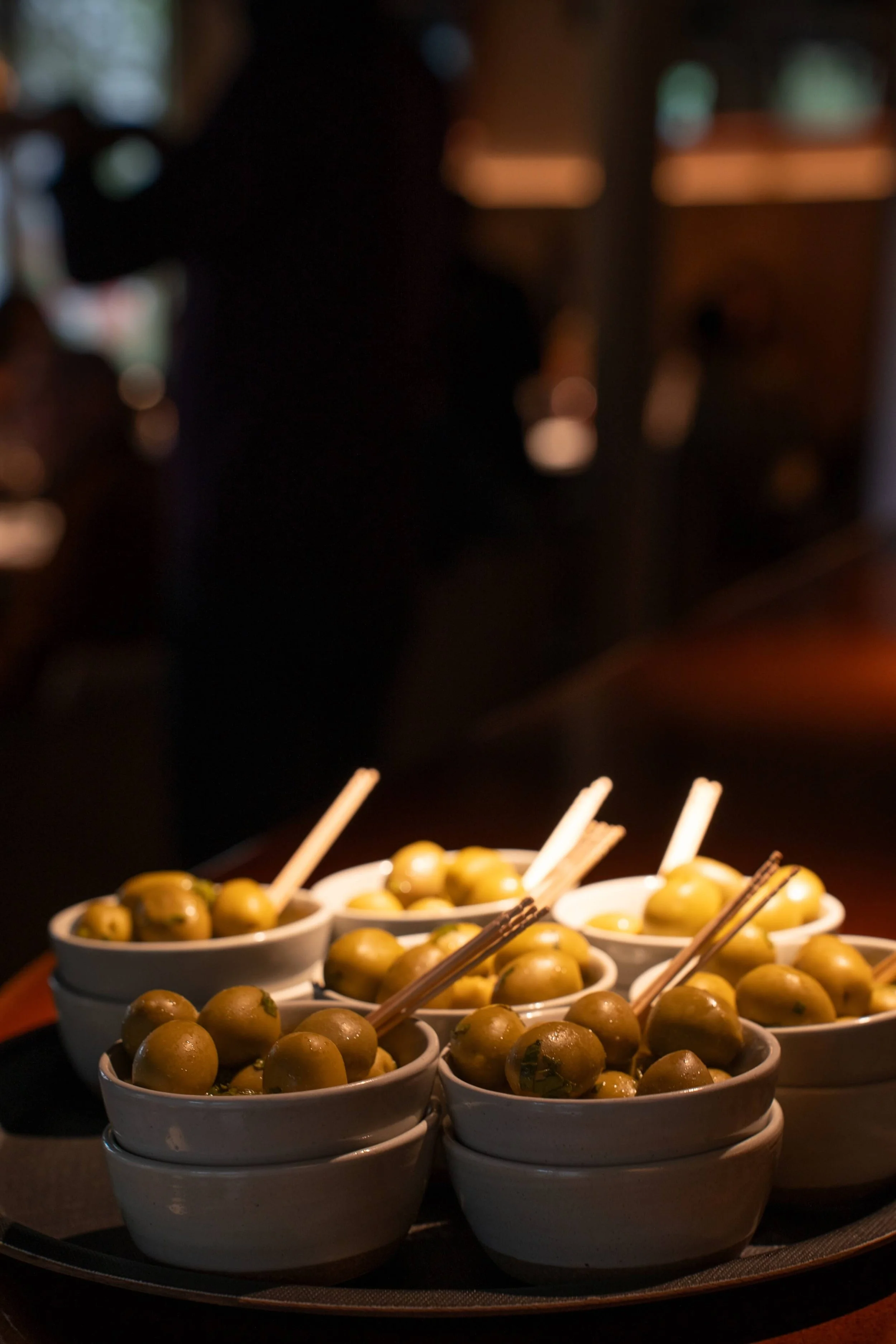 Bowls of marinated green olives served as an aperitif at Neri restaurant