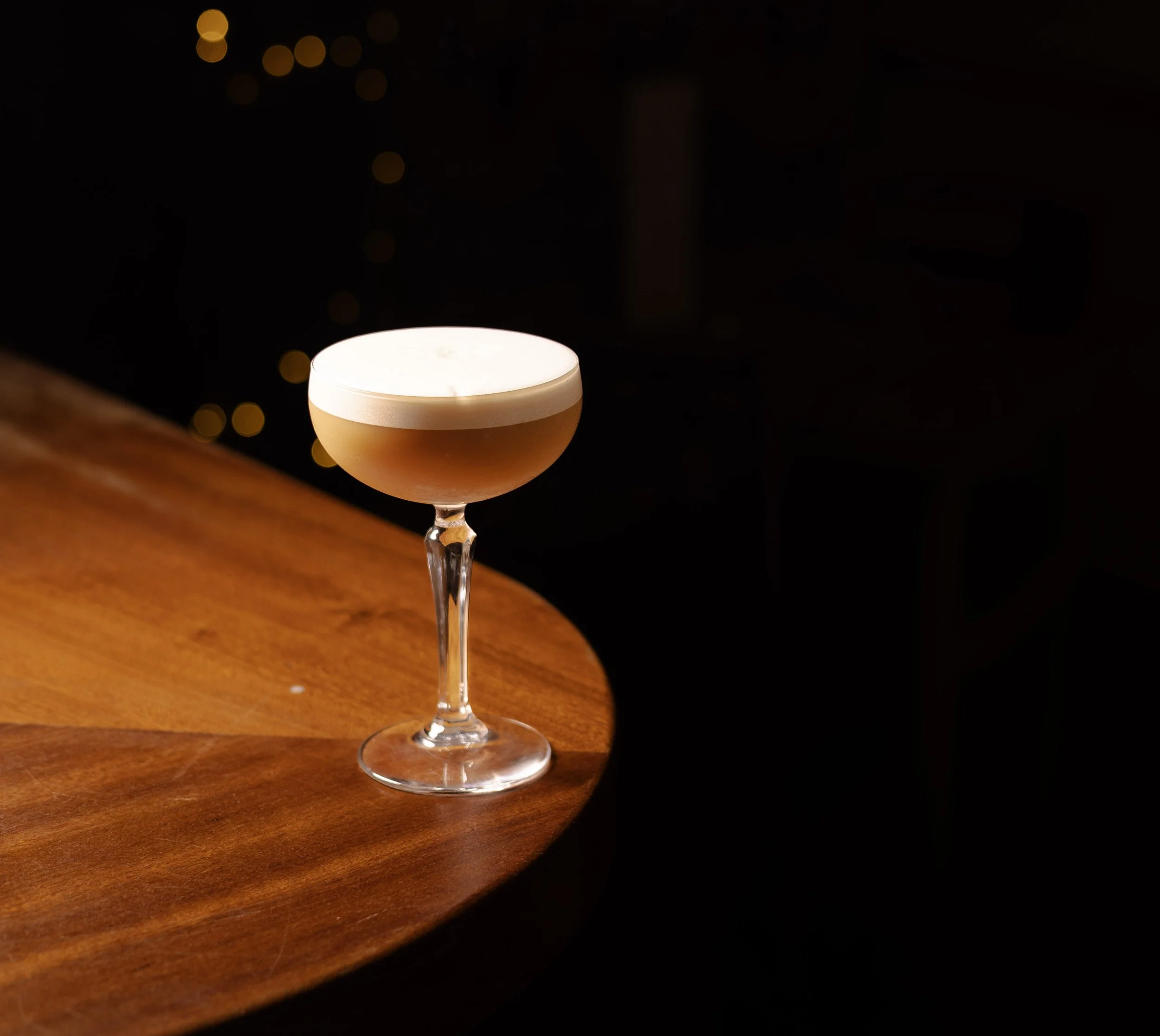 The Thai Me Up cocktail at Jup Jup Thai Restaurant and Bar in Ludlow, Shropshire, made with Thai tea–infused vodka and inspired by authentic Thai flavours.