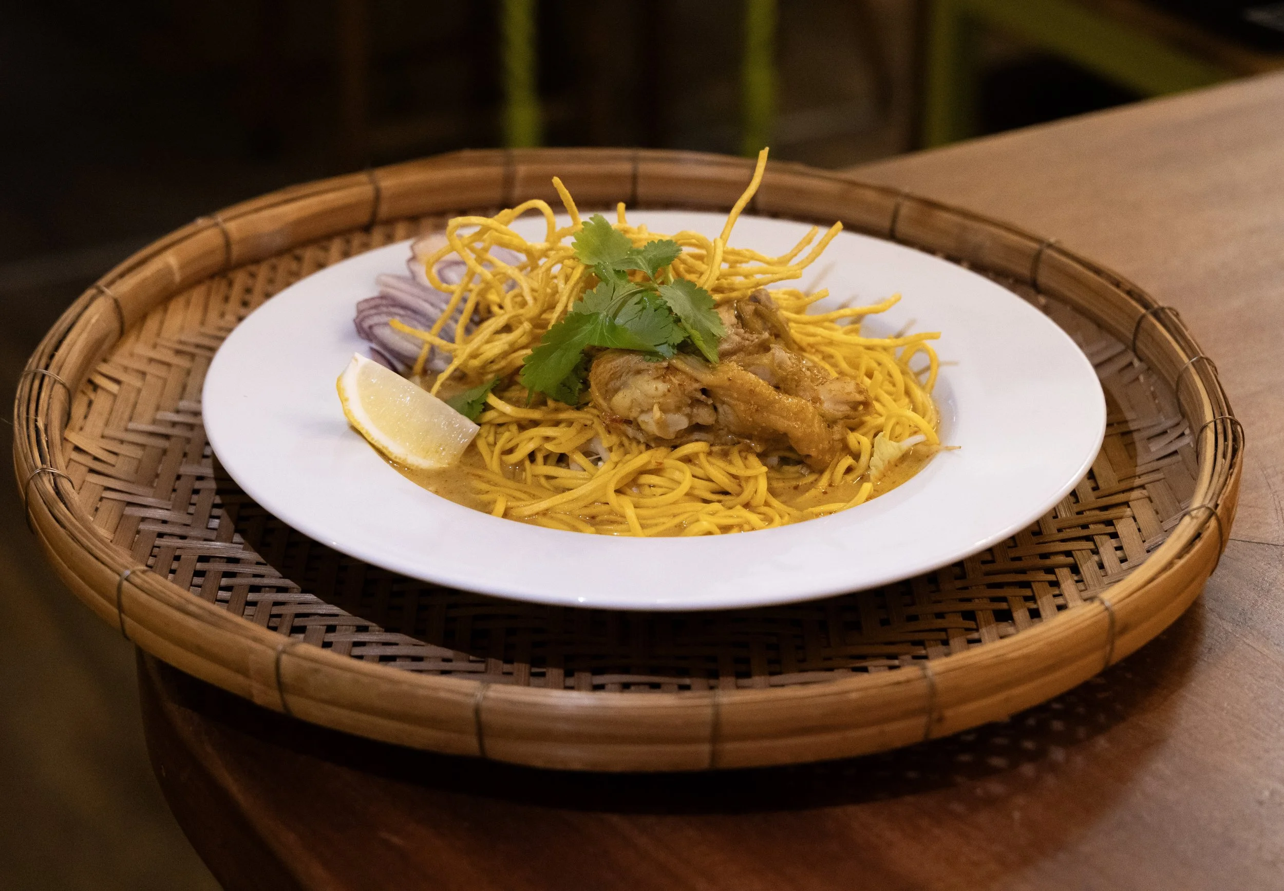 Chicken Khao Soi lunch special at Jup Jup Thai Restaurant and Bar in Ludlow, a comforting Northern Thai curry noodle dish.