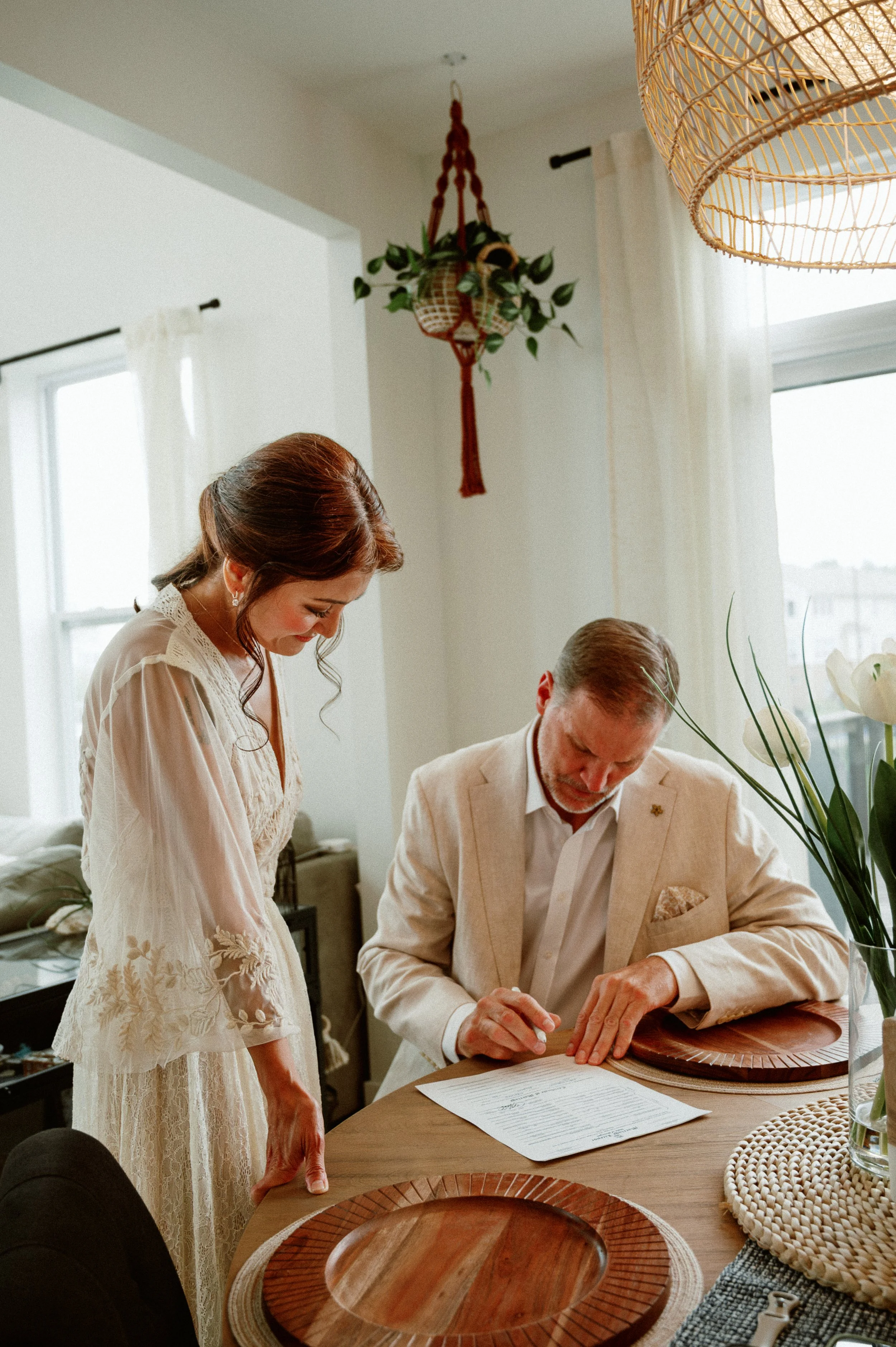 Couple signing their marriage license at an intimate Michigan elopement