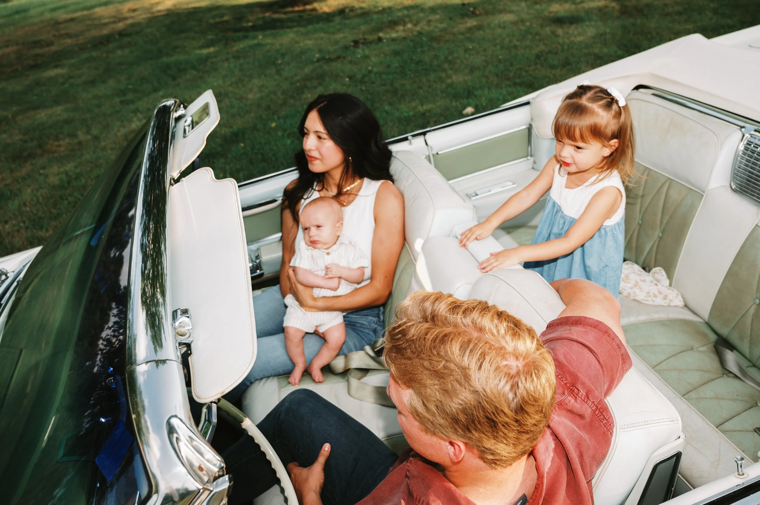 Michigan family riding in a vintage convertible during a lifestyle photo session