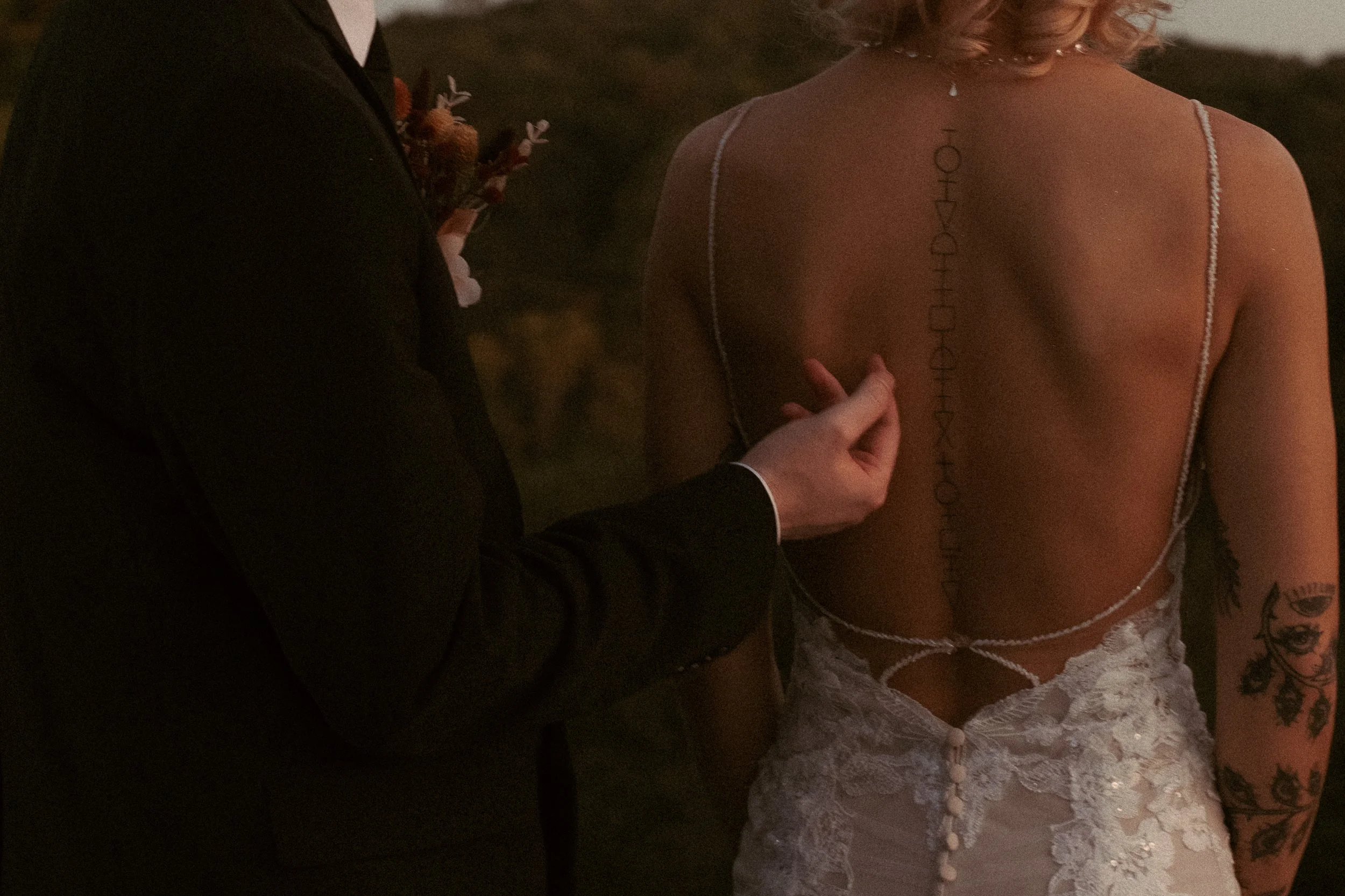 Travel elopement groom gently touching his bride