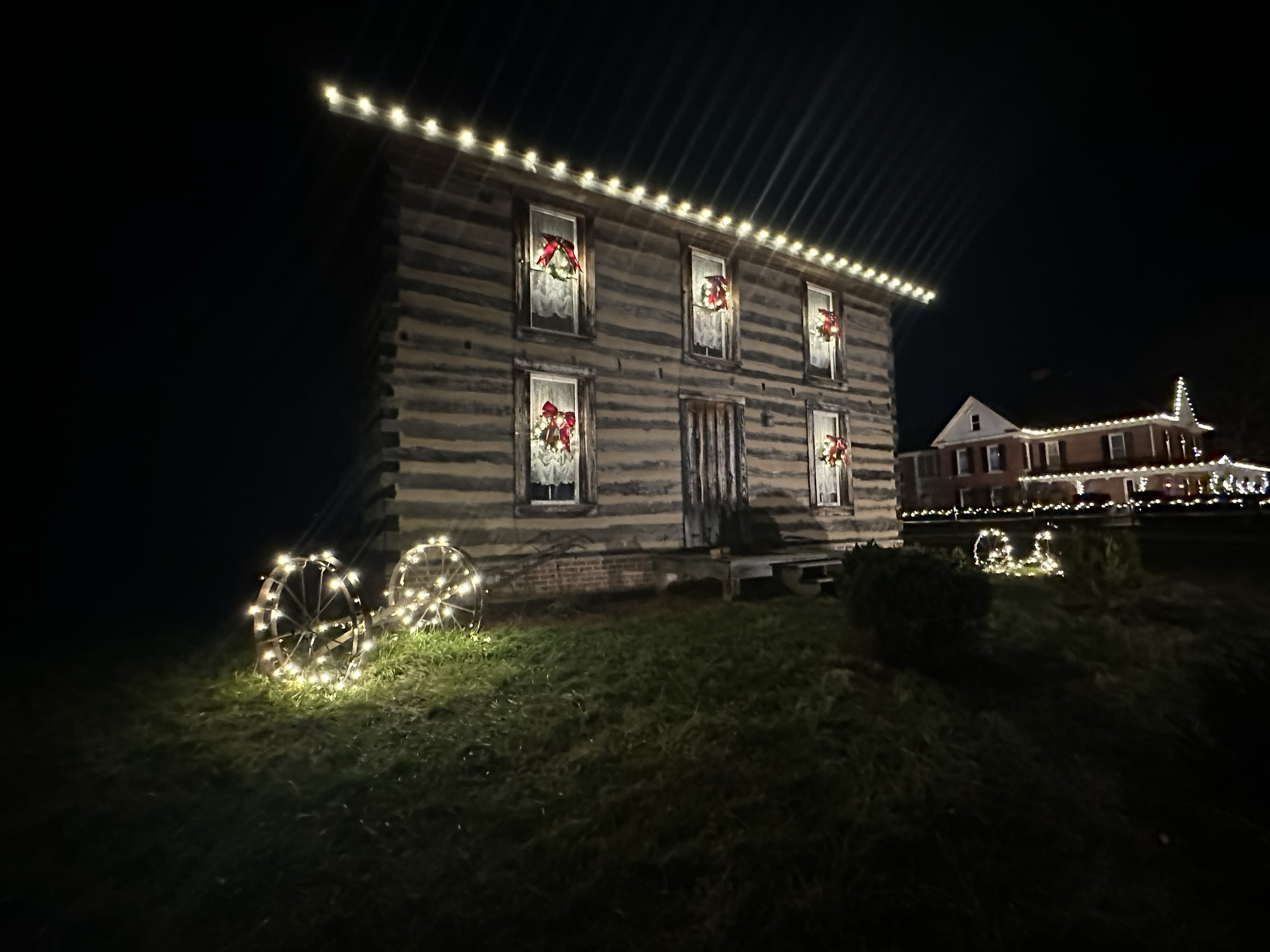 Lights and wreaths on barn 