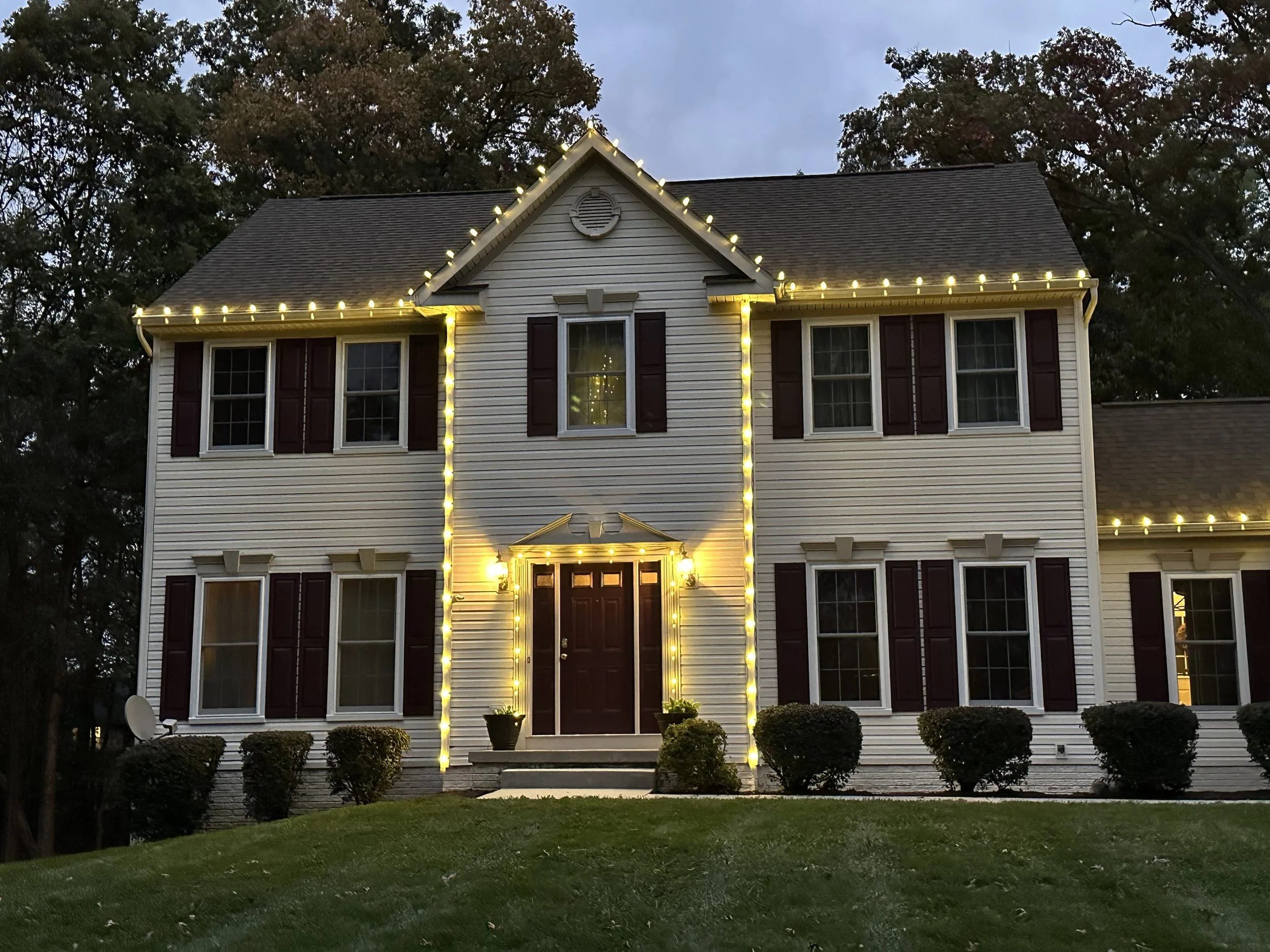 White Christmas light on two-story house