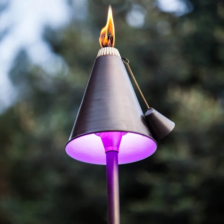 LED tiki torch glowing at dusk