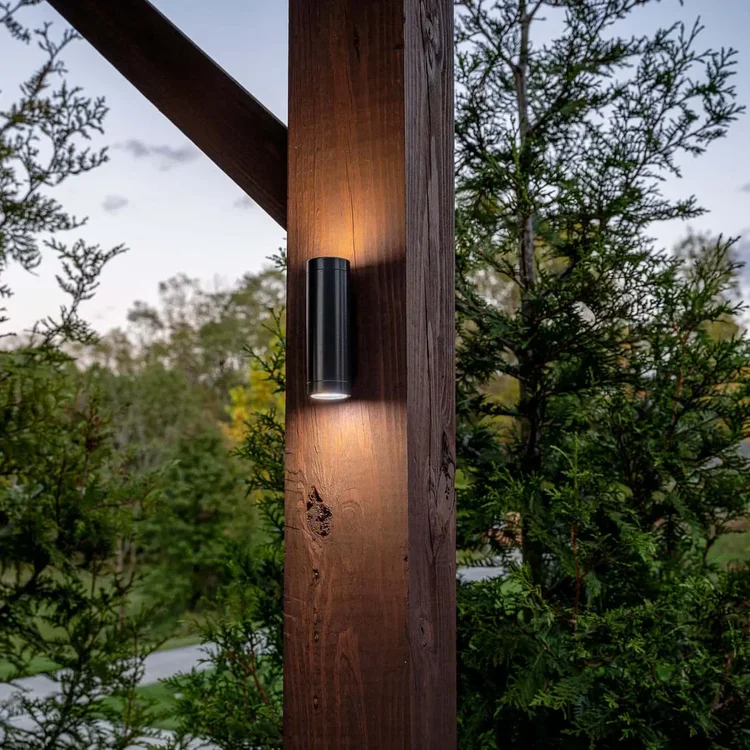 Warm white wall sconce on exterior wall