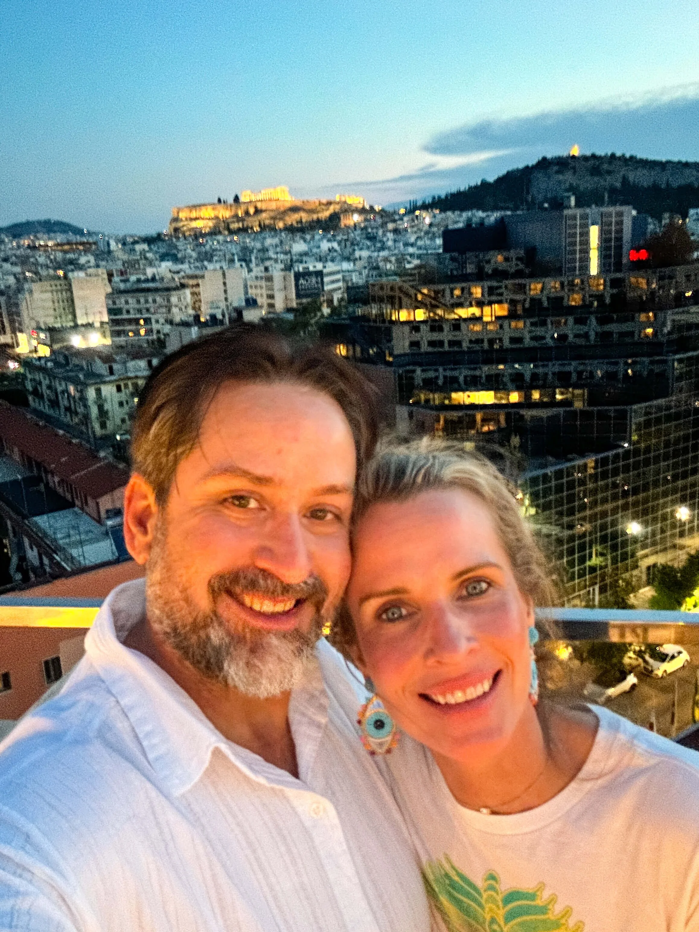 Melissa Greenwood CFP with city skyline with husband