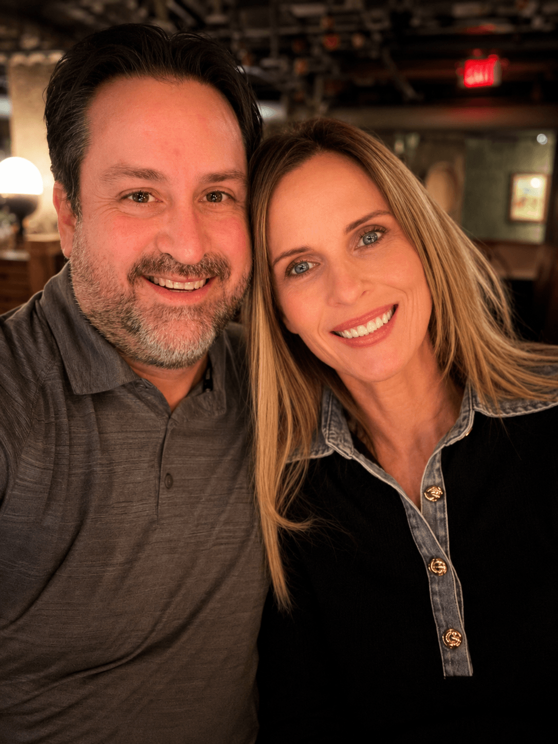 Melissa Greenwood CFP with husband in restaurant