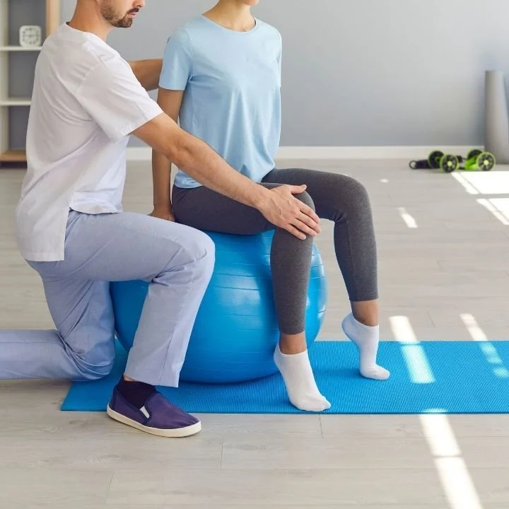 Physiotherapist guiding a patient through rehabilitation exercises, representing physiotherapy treatments at Kerala Ayurveda Clinic Leicester.