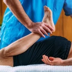Post workout muscle recovery massage in Leicester combining Ayurvedic oil massage, physiotherapy techniques and stretching.