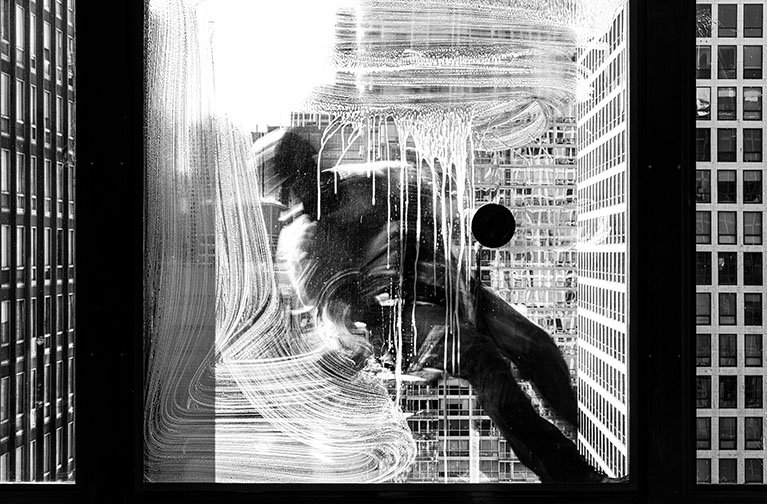 SOAP ACROBAT, ’25 
 
Limited Edition of 9 and 3AP 
Signed by the Artist 
17” x 22” | “30 x 40” 
 
Digital Photography | A slow shutter speed photograph effectively crystallizing the window washer’s entire one-line soap trail | Archival pigment print 