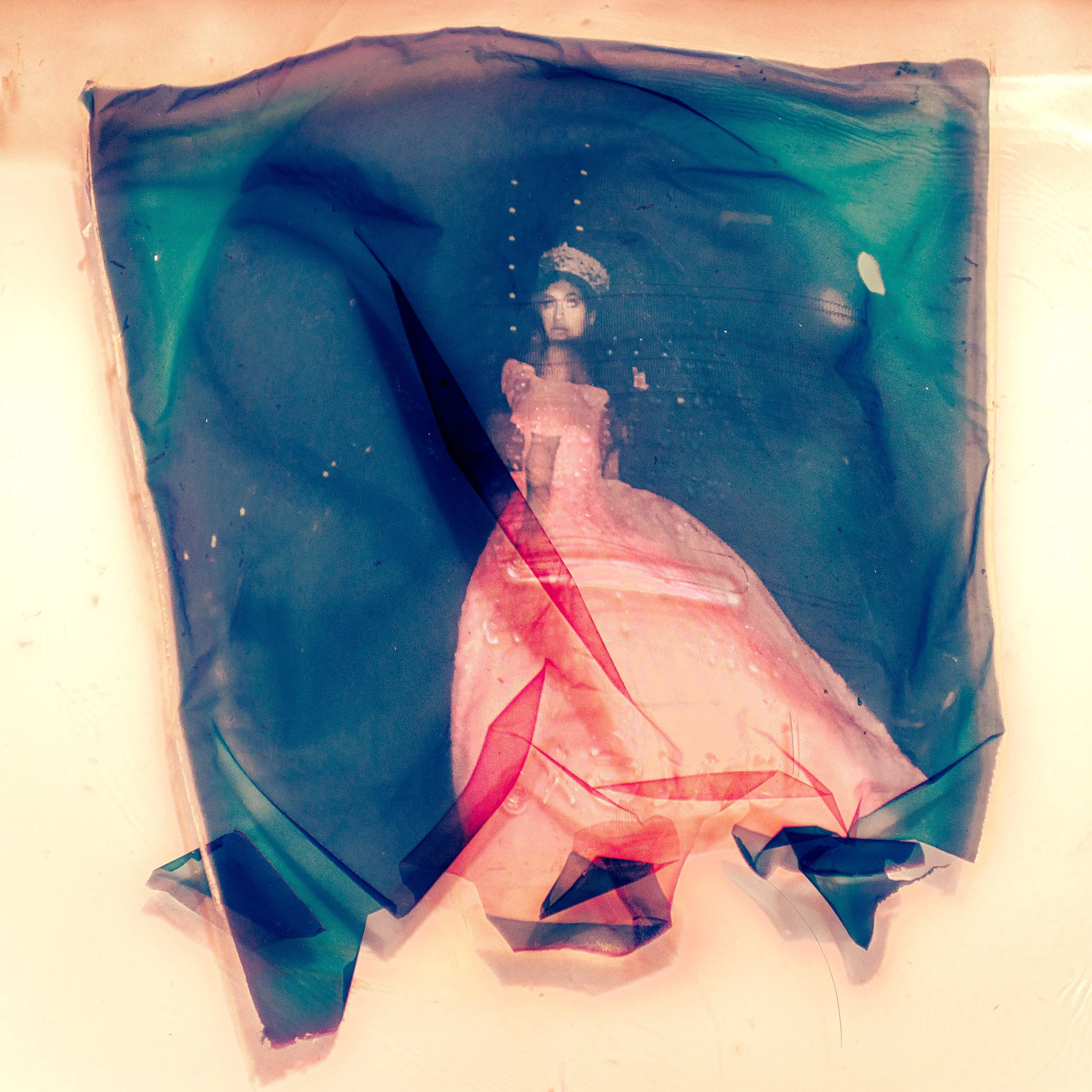 TINY DANCER, 24’  
Limited Edition of 9 and 3AP  
Signed by the Artist  
17” x 22” | “30 x 40”  
  
Digital Photography | A photograph of a Polaroid Emulsion Floating in Pyrex Glass | Archival Pigment Print 
  
This is a digital photograph I took of 