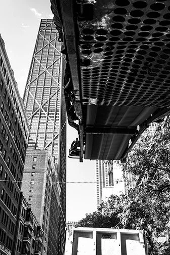 HEAVY MACHINERY, 25’ 
 
Limited Edition of 9 and 3AP 
Signed by the Artist 
17” x 22” | “30 x 40” 
 
Digital Photography | A photograph underneath or perhaps from the perspective of an asphault milling machine | Archival Pigment Print 